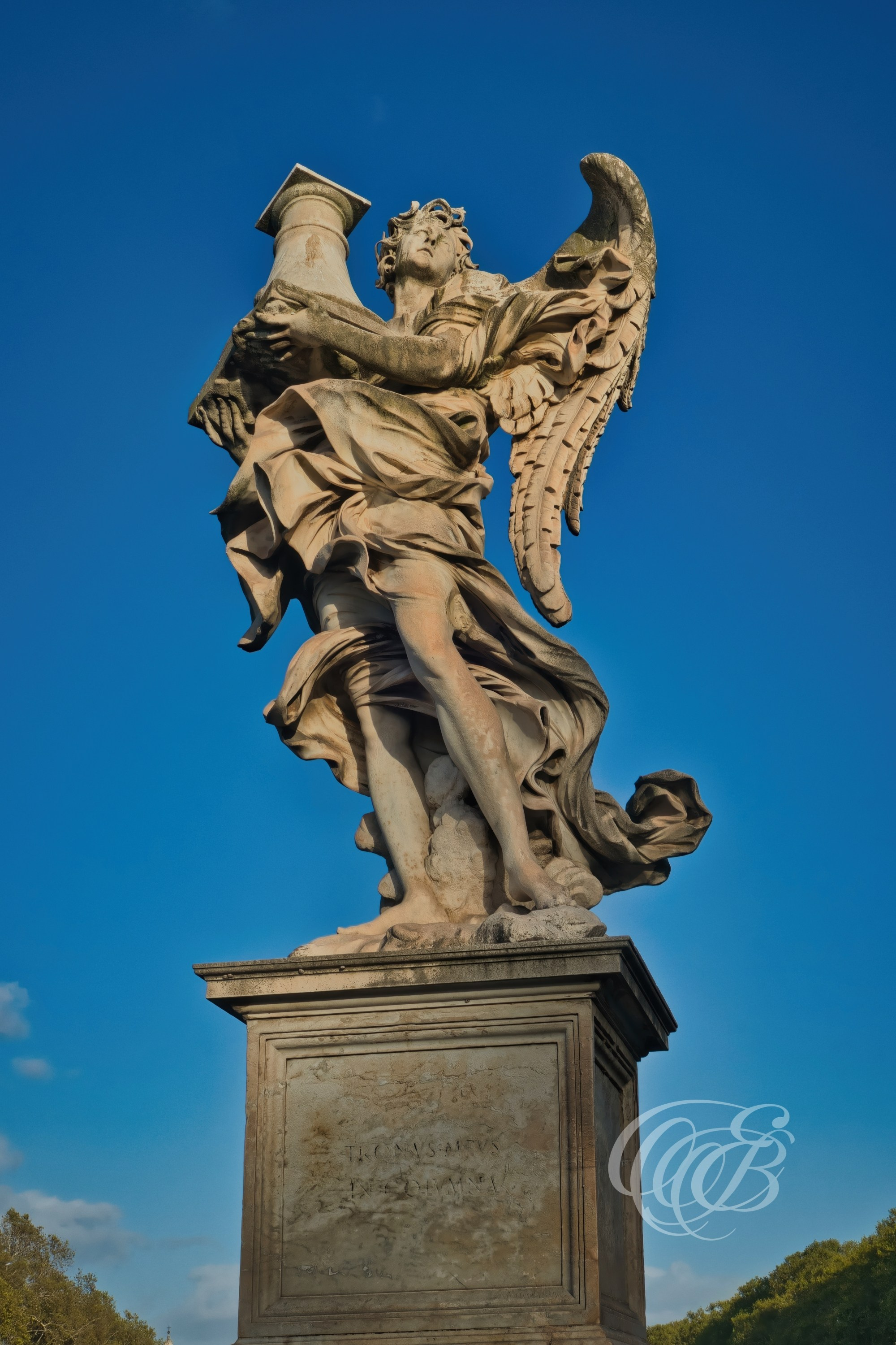 ITALY TRAVEL PHOTOGRAPHY – ITALY – ROME — Angel Carrying the Column on Ponte Sant’Angelo — Baroque angel sculpture holding the Column of the Flagellation on Ponte Sant’Angelo, designed under Gian Lorenzo Bernini, Rome, Italy — Eduardo Bartoli Photography.