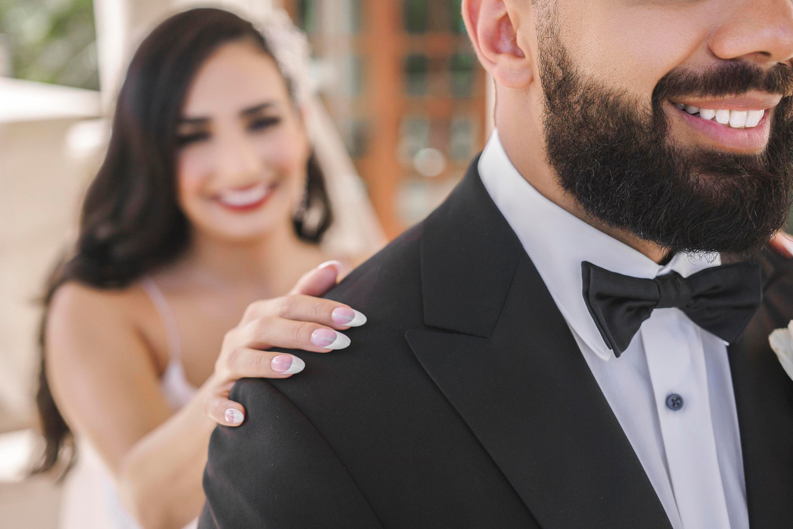 Bride walking toward groom for first look in Playa del Carmen resort