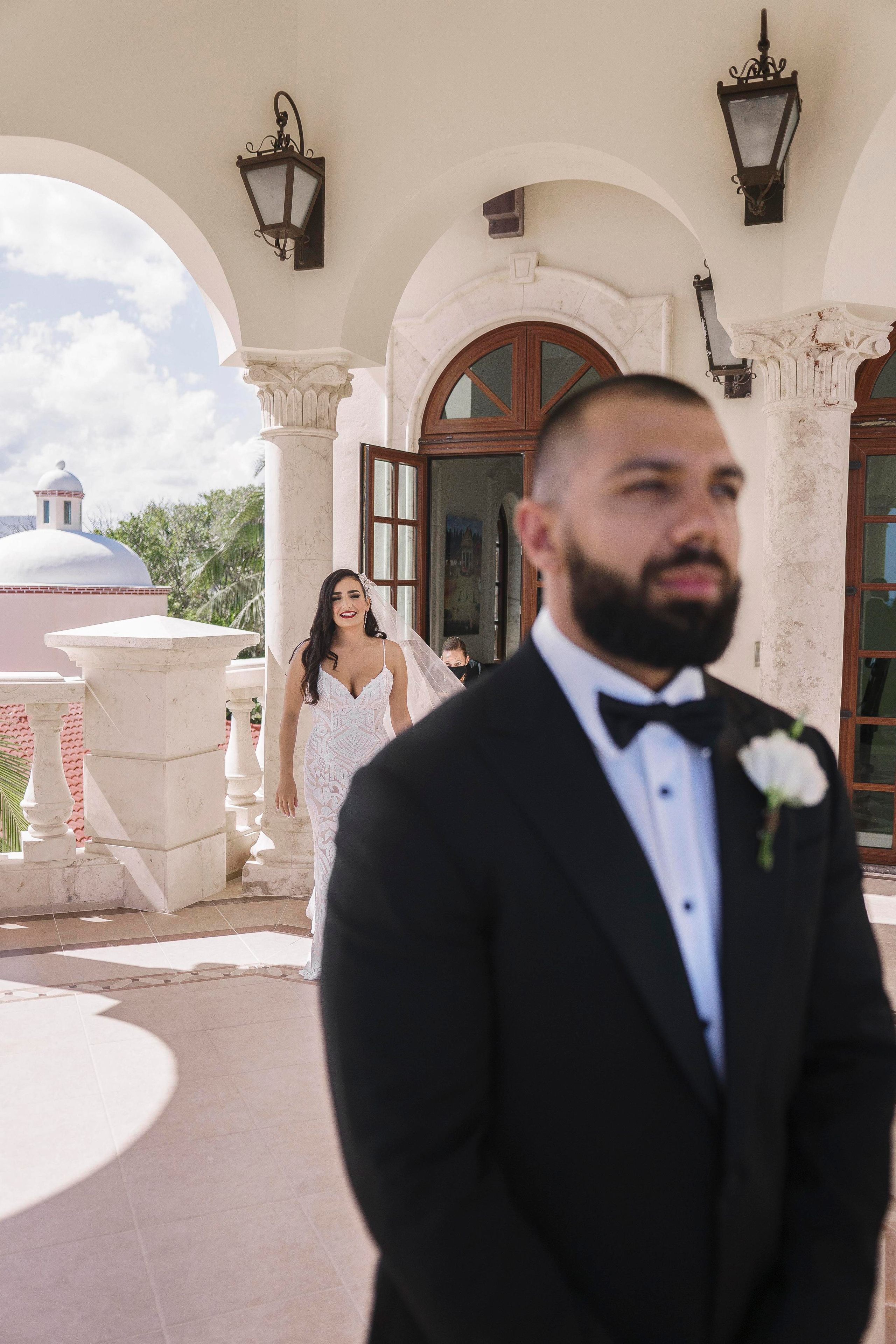 Emotional first look photo captured in Cancun by wedding photographer