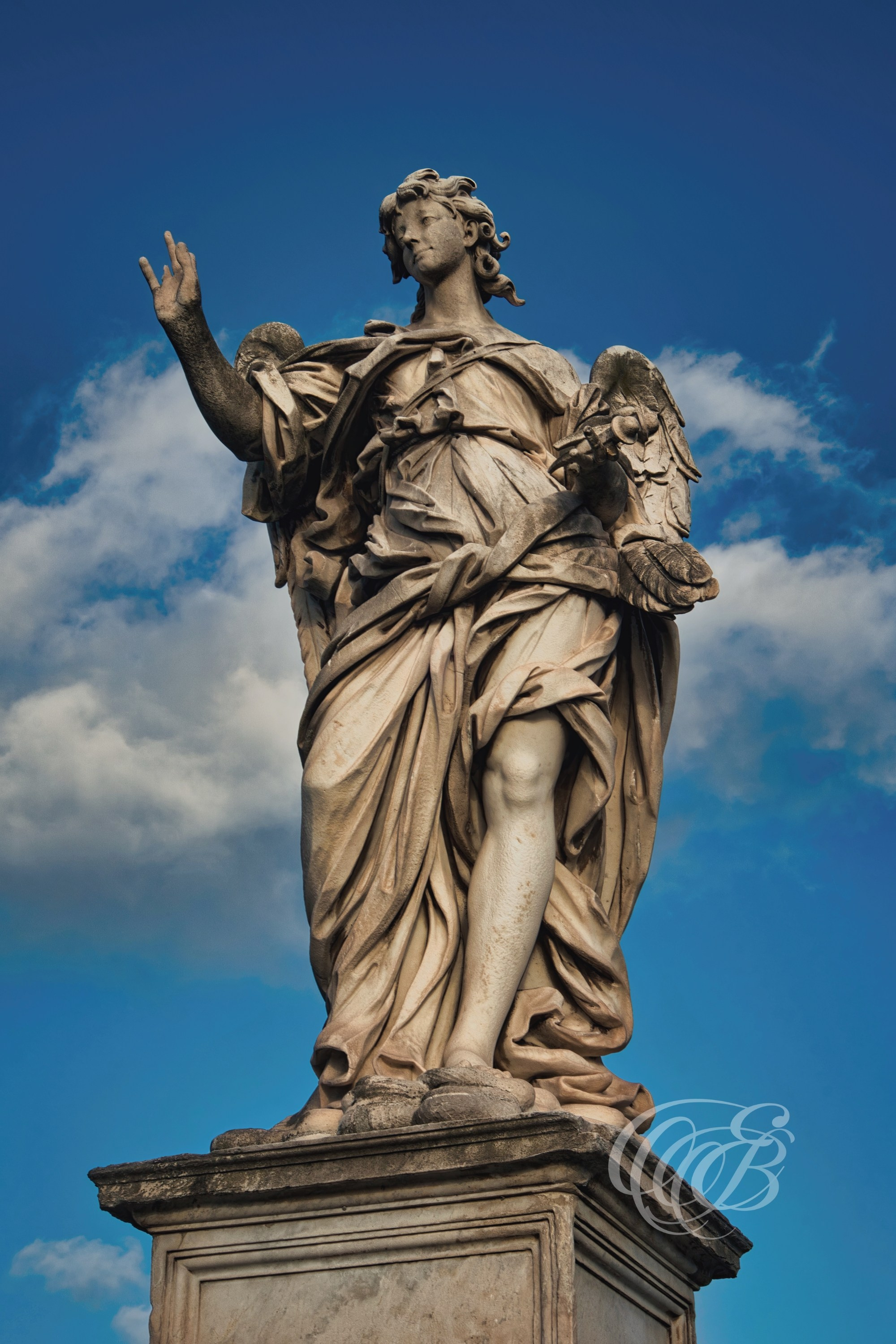 ITALY TRAVEL PHOTOGRAPHY – ITALY – ROME — Angel with the Nails on Ponte Sant’Angelo — Baroque angel sculpture holding the nails of the Passion on Ponte Sant’Angelo, designed under Gian Lorenzo Bernini, Rome, Italy — Eduardo Bartoli Photography.