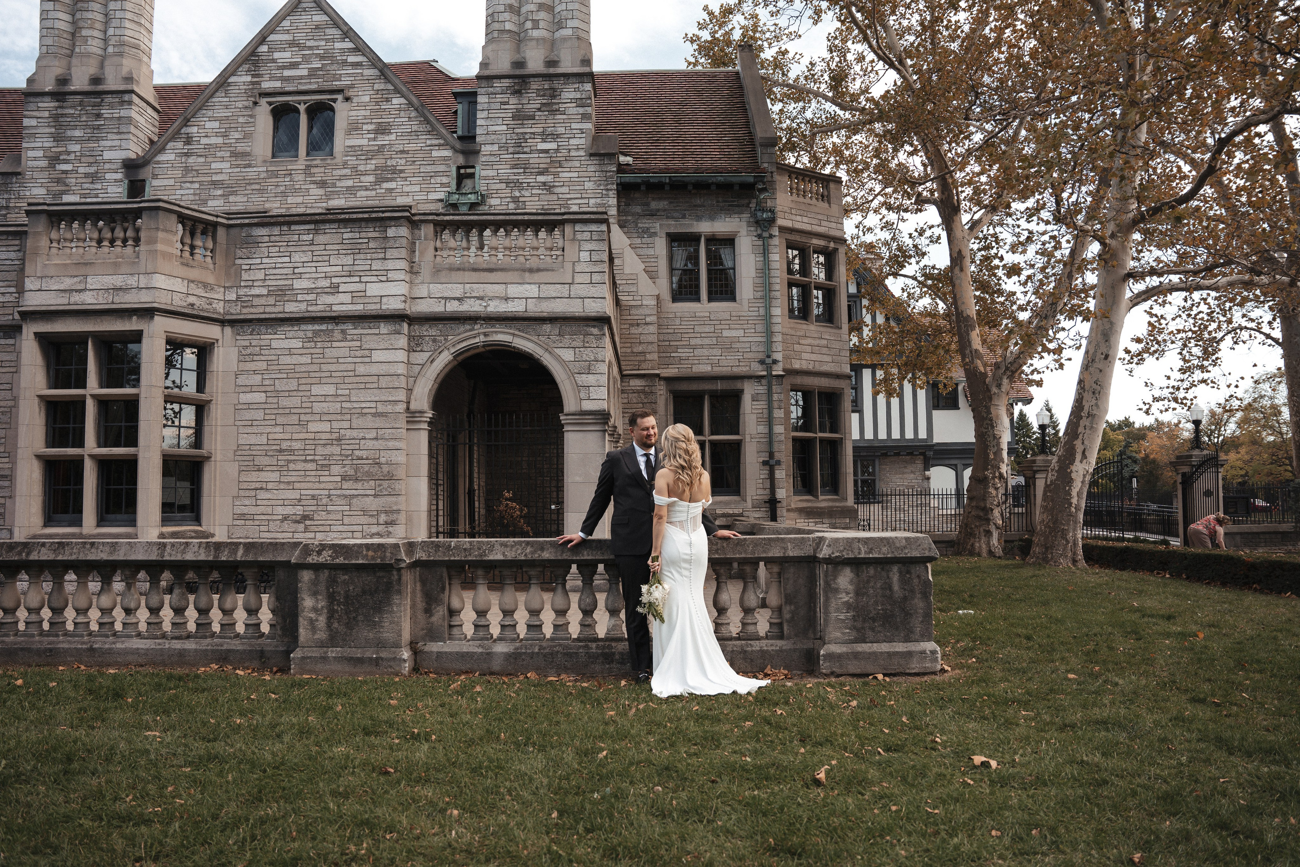 Engaged couple walking through Willistead Park in Windsor, Ontario