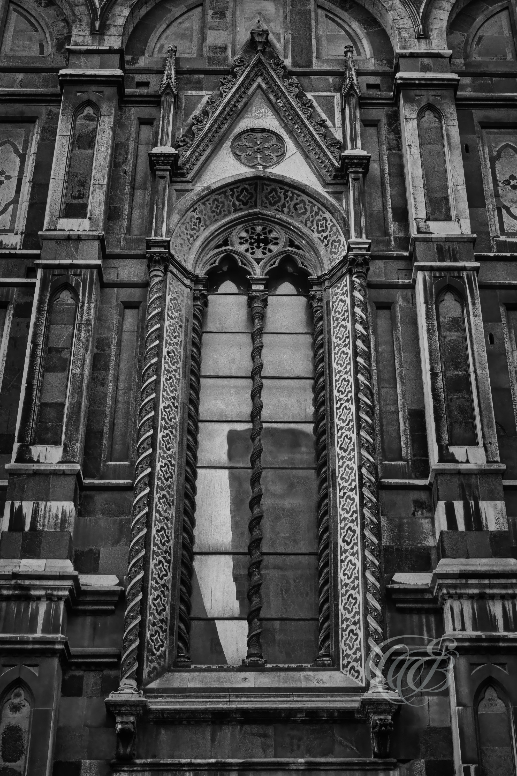 ITALY – FLORENCE — Gothic Windows of Santa Maria del Fiore Cathedral Black and White — Detailed view of pointed Gothic window tracery on Florence Cathedral façade, showing carved stonework, architectural geometry, and historic religious structure, Florence, Italy — Eduardo Bartoli Photography.
