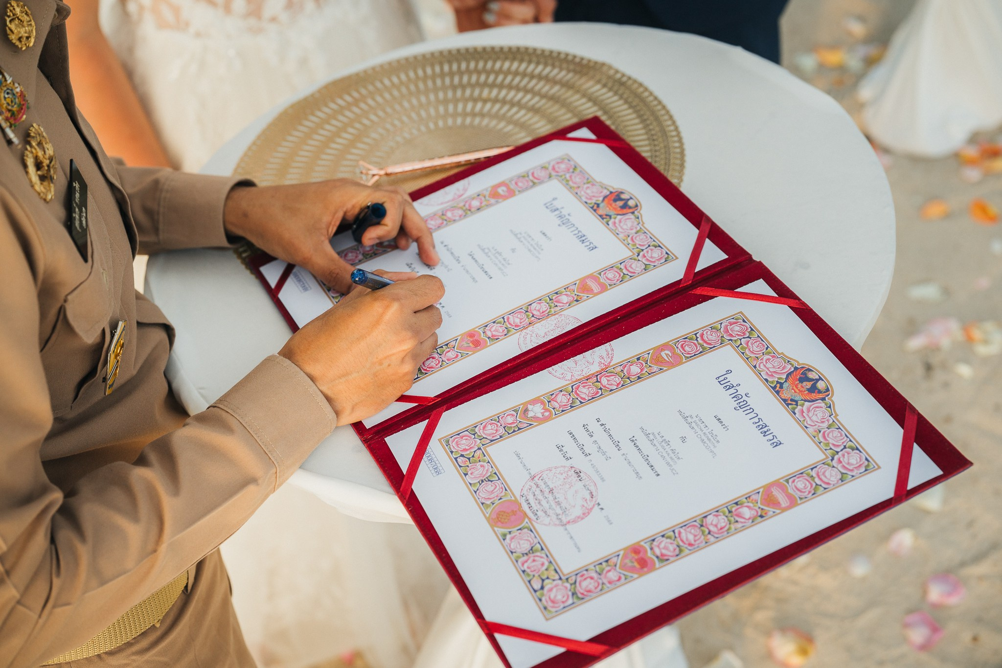 Destination beach wedding in Koh Samui, Thailand with the couple, family members and friends enjoying a tropical wedding ceremony by the sea