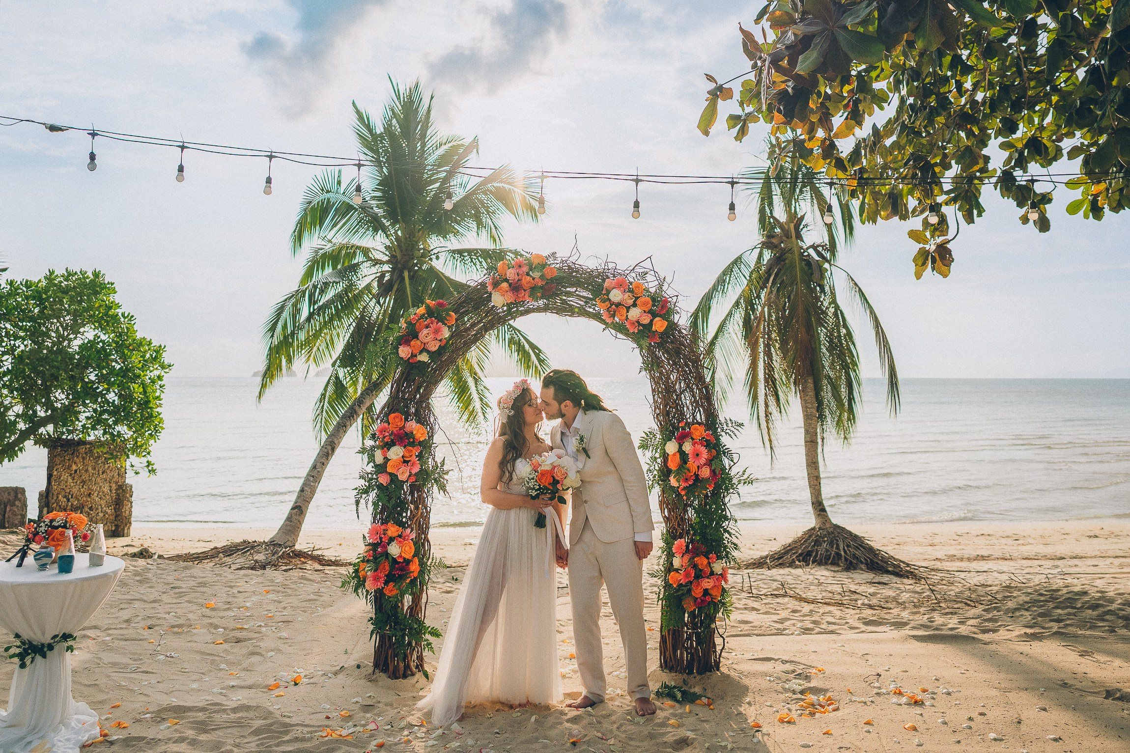 Bride and groom enjoying a just for 2 beach wedding in Koh Samui, Thailand, surrounded by tropical scenery and ocean views