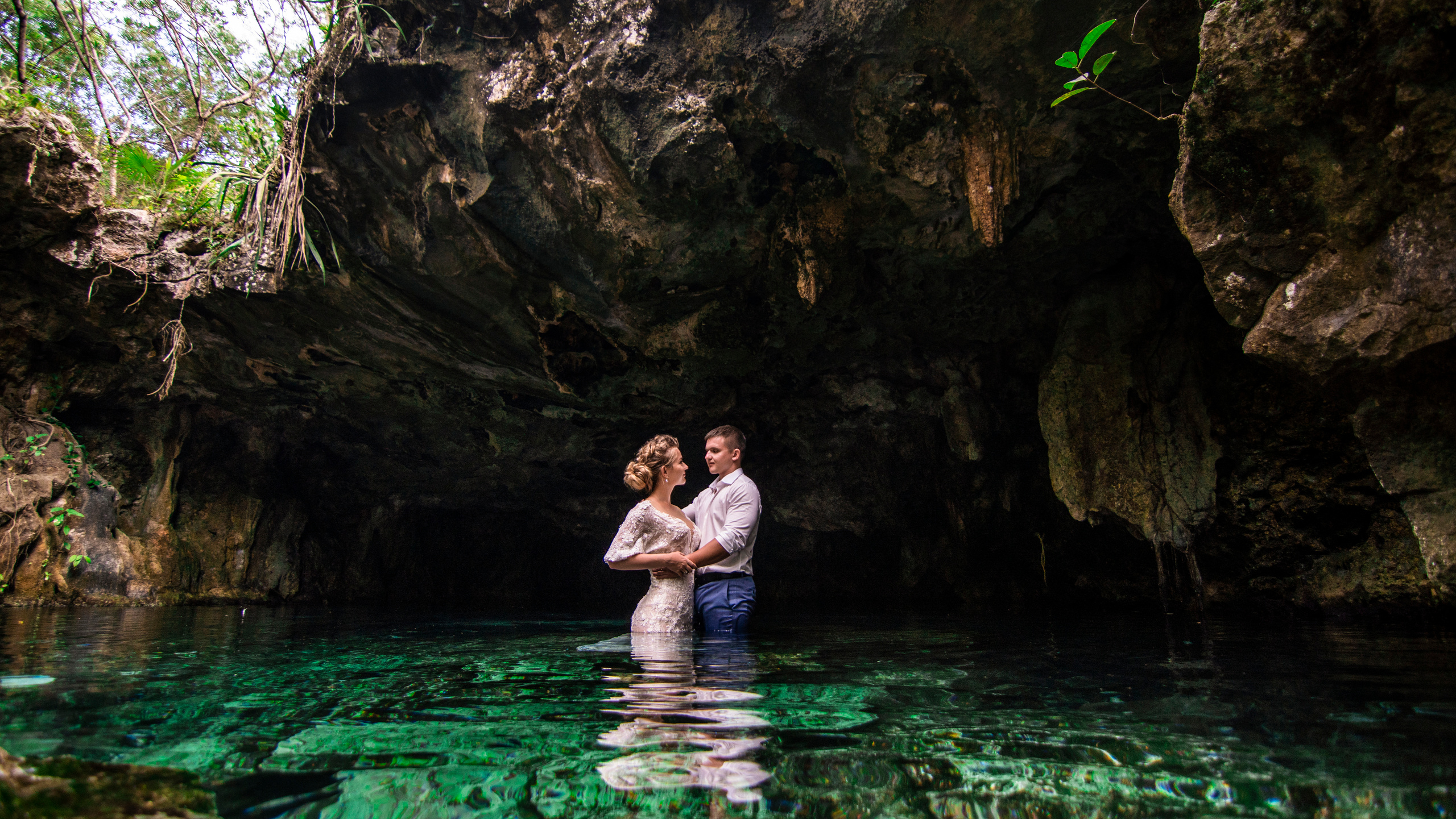 Couple celebrating their love in a mystical cenote