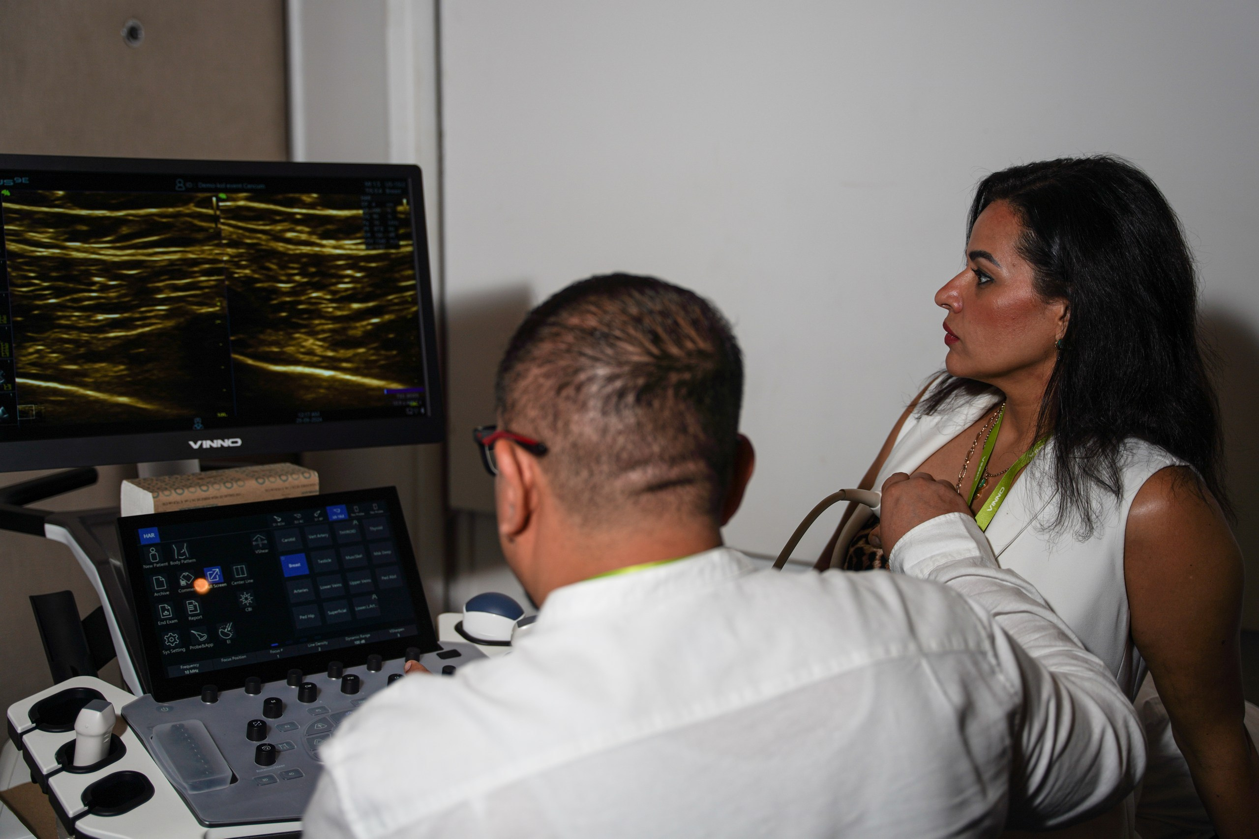 Doctors examining innovative medical technology displayed at the event.