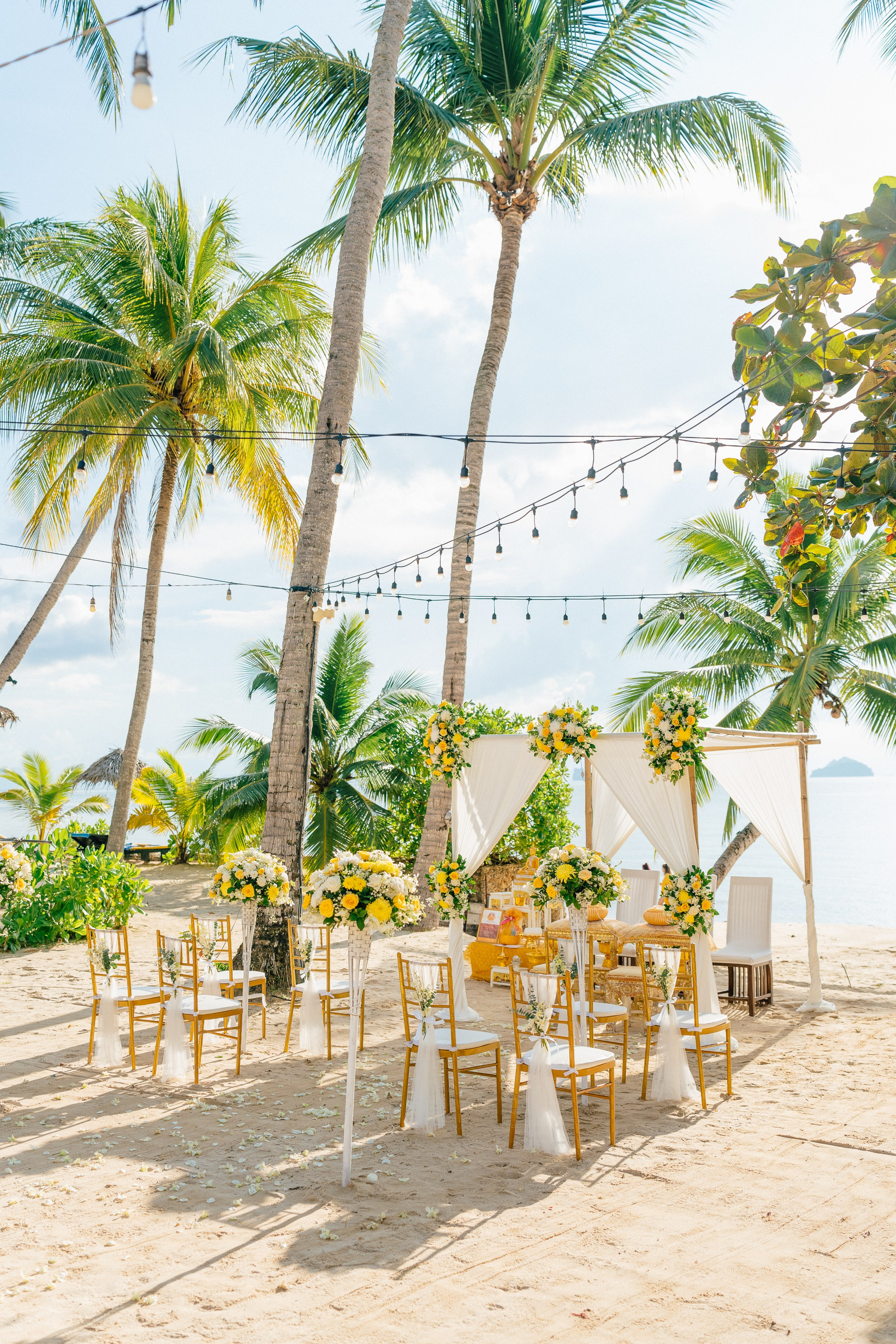 Couple celebrating a spiritual Buddhist wedding ceremony on Koh Samui