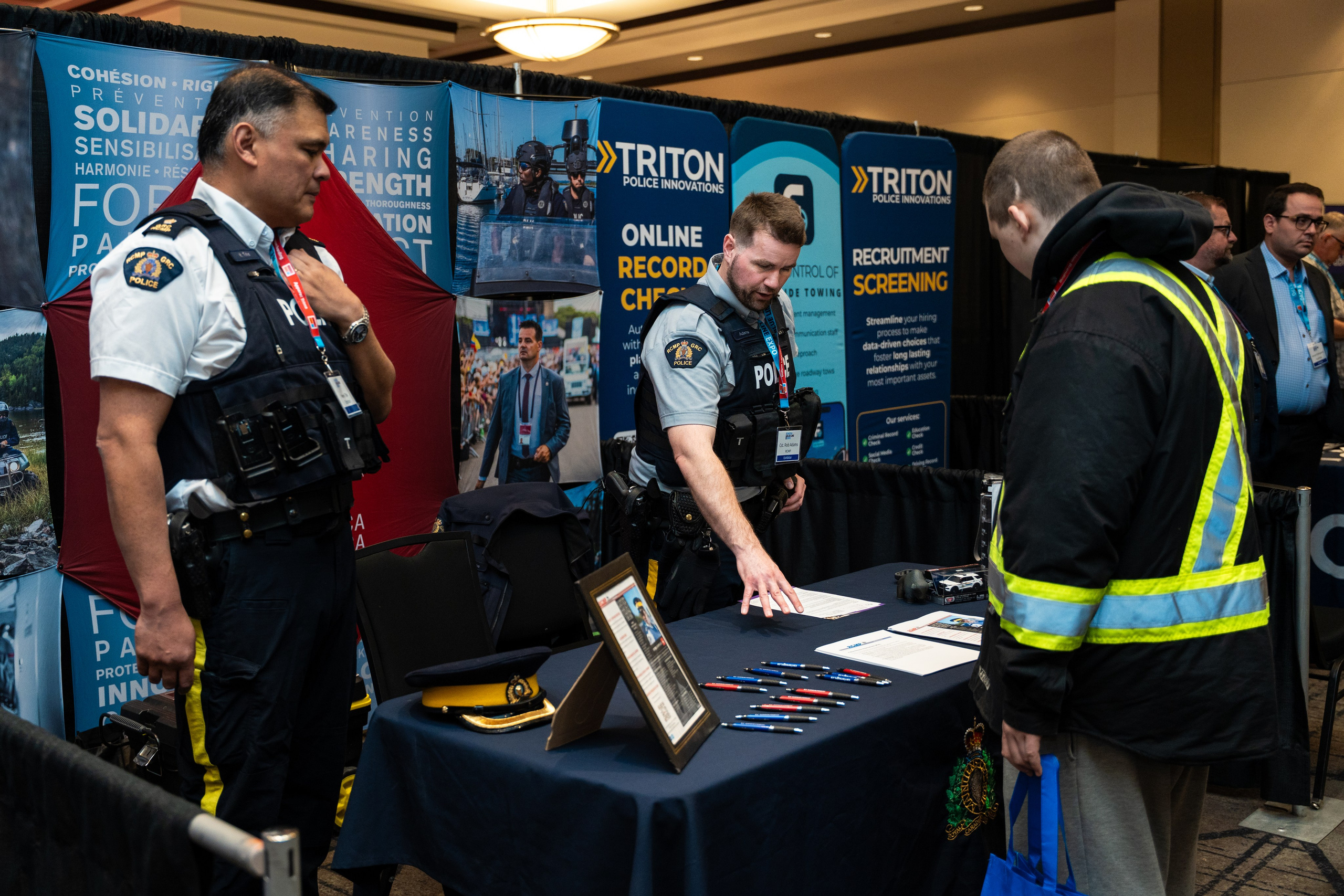 Attendees in safety gear browsing booth, Blueline Expo 2026