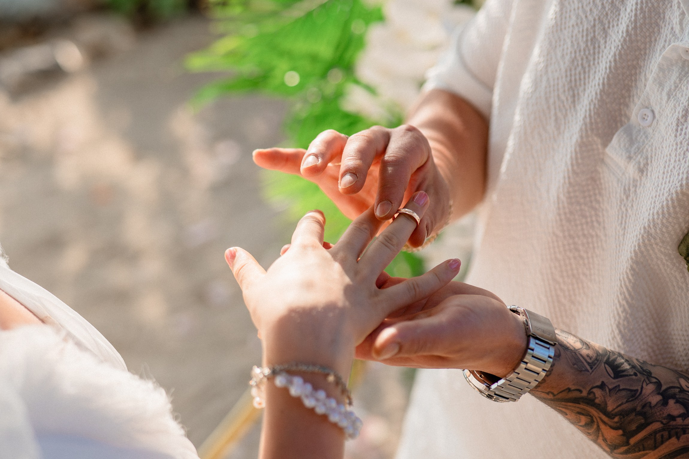 Bride and groom during a romantic beach wedding ceremony on Koh Samui, Thailand, surrounded by tropical scenery and ocean views