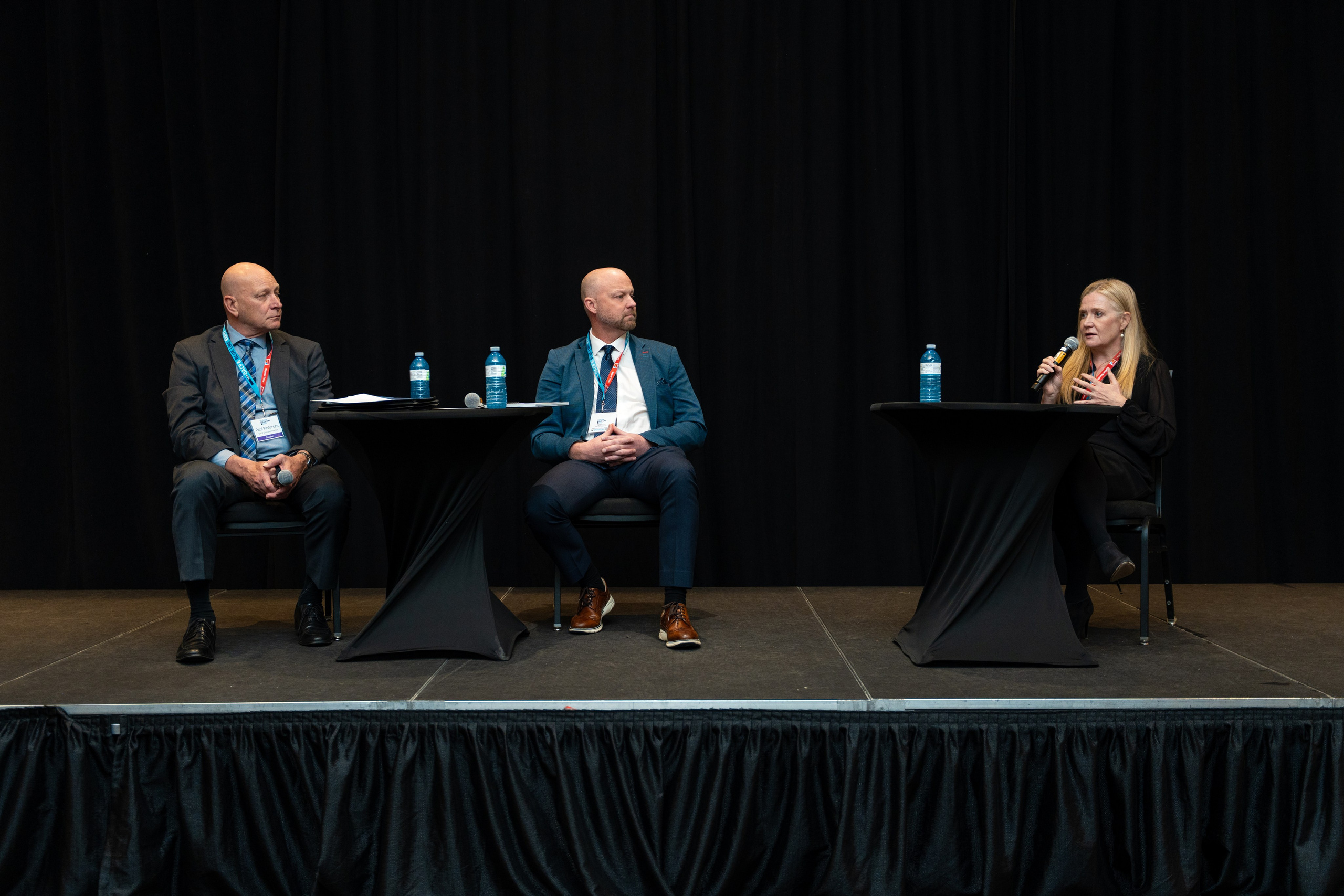Panel discussion with speakers seated on stage, Blueline Expo