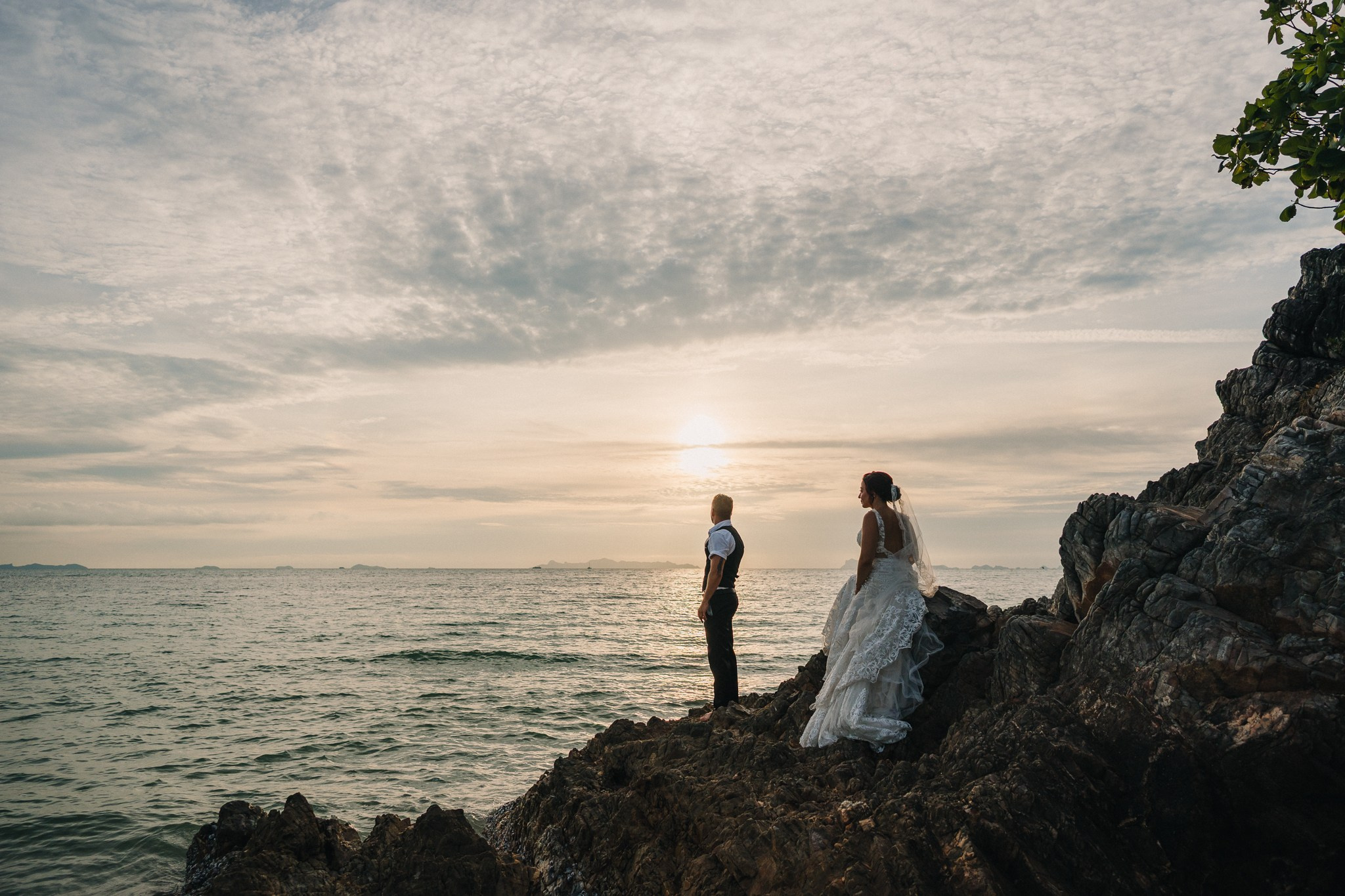 Intimate family wedding on the beach in Koh Samui, Thailand with the couple and their children enjoying the ceremony together