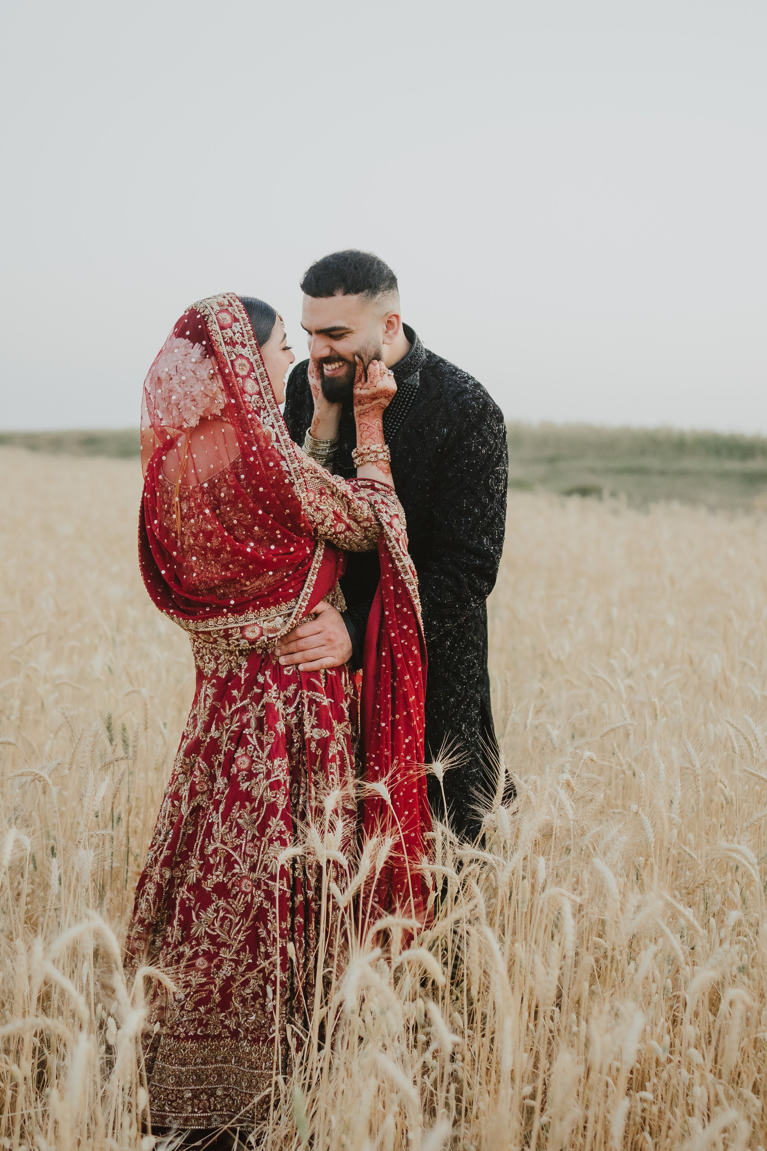 Couple shoot in the fields during sunset 