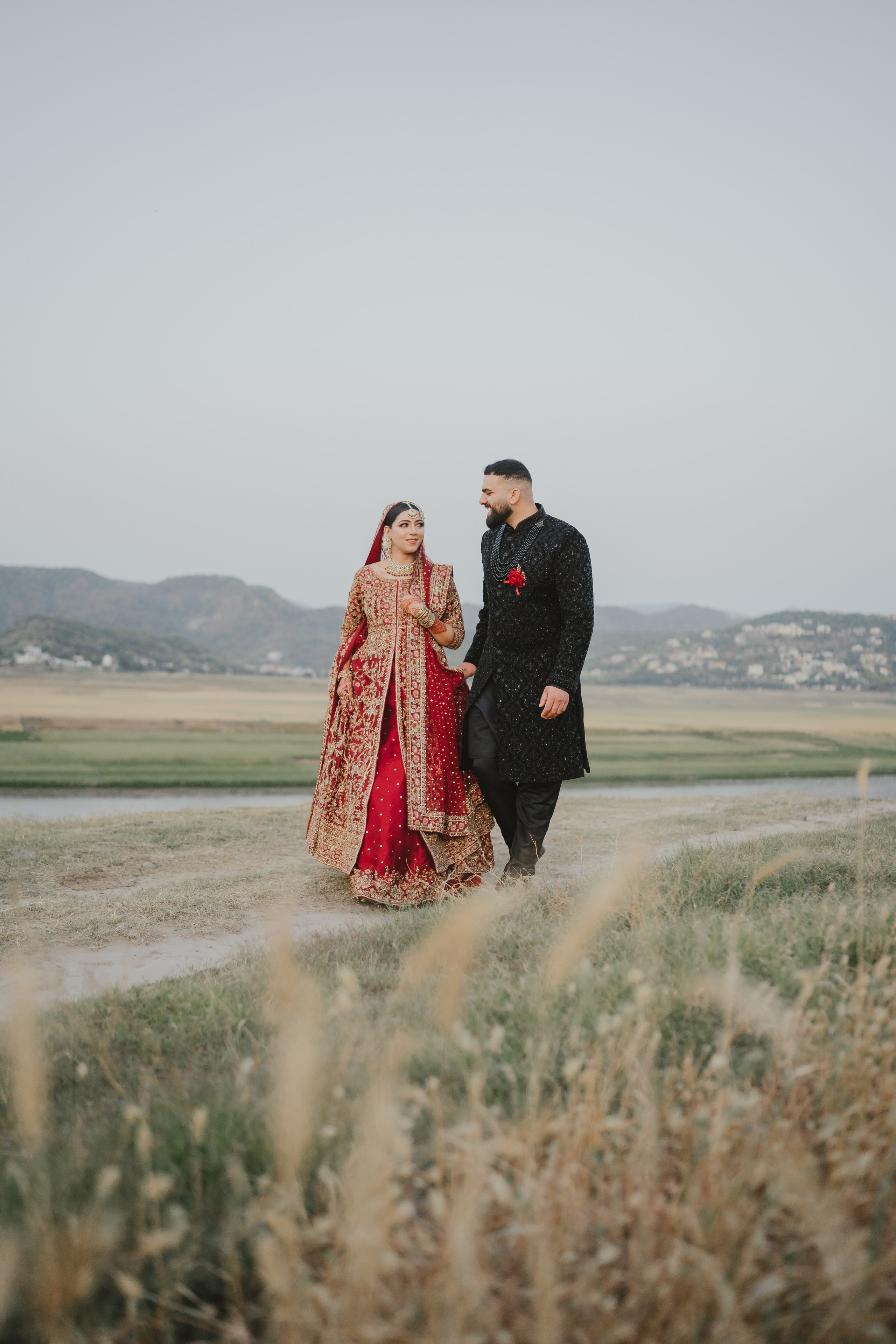 Couple shoot in the fields during sunset 