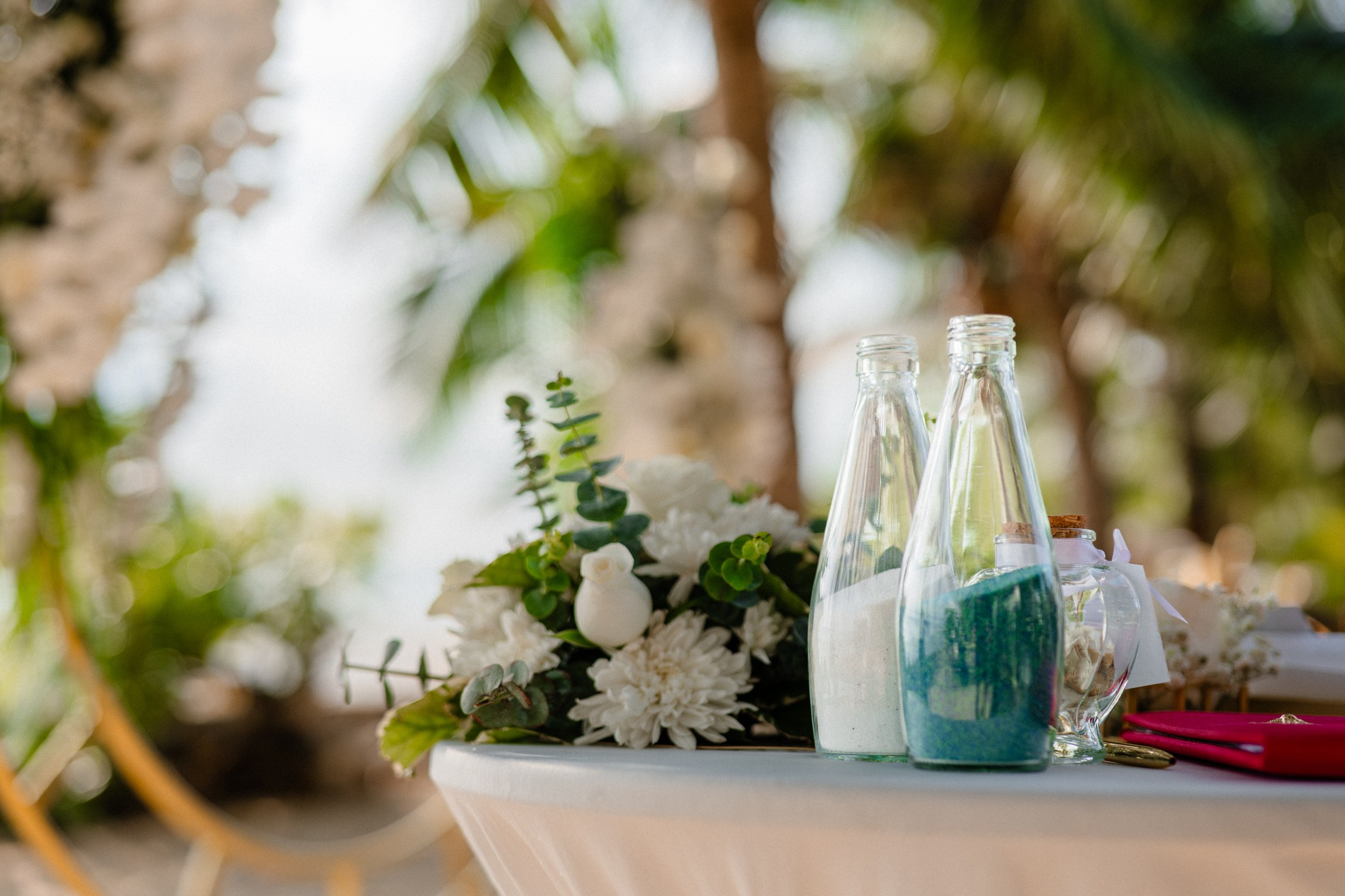 Bride and groom exchanging vows on a private sunset beach