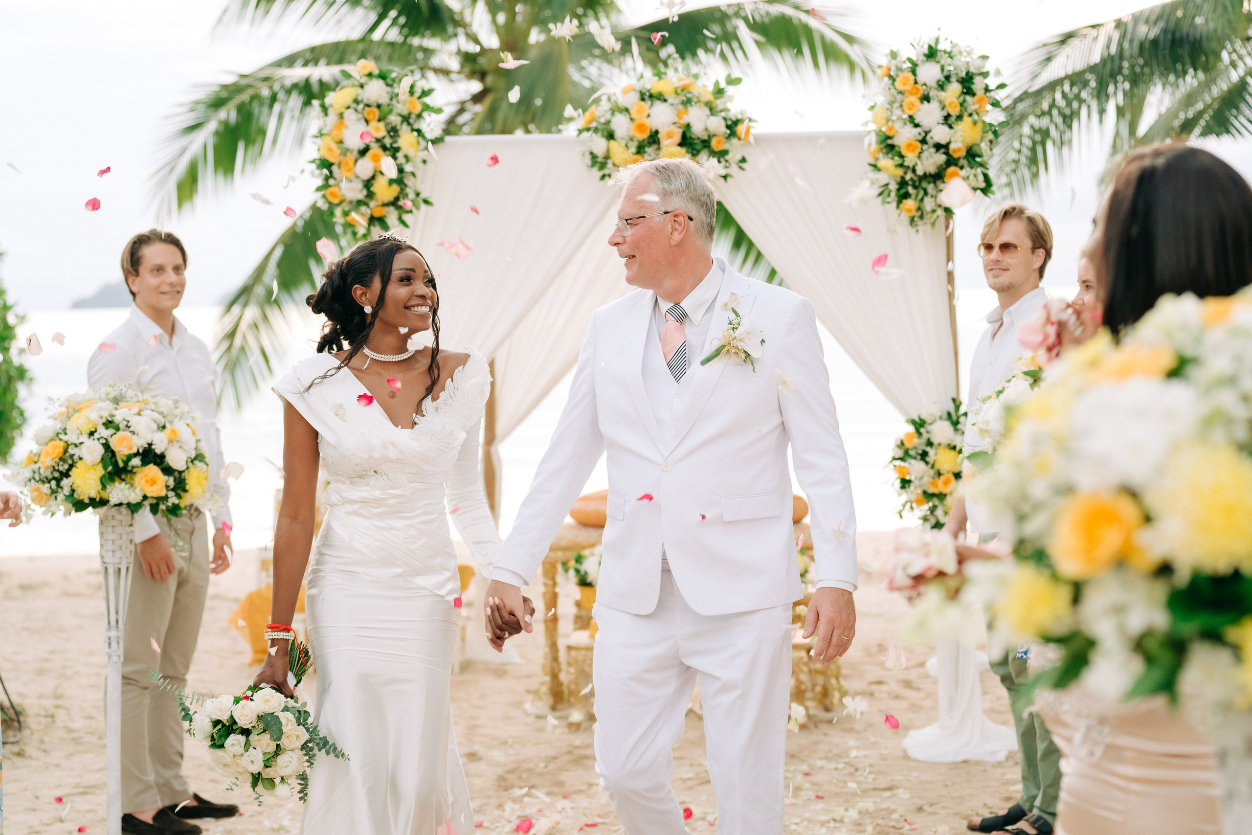 Couple celebrating a spiritual Buddhist wedding ceremony on Koh Samui
