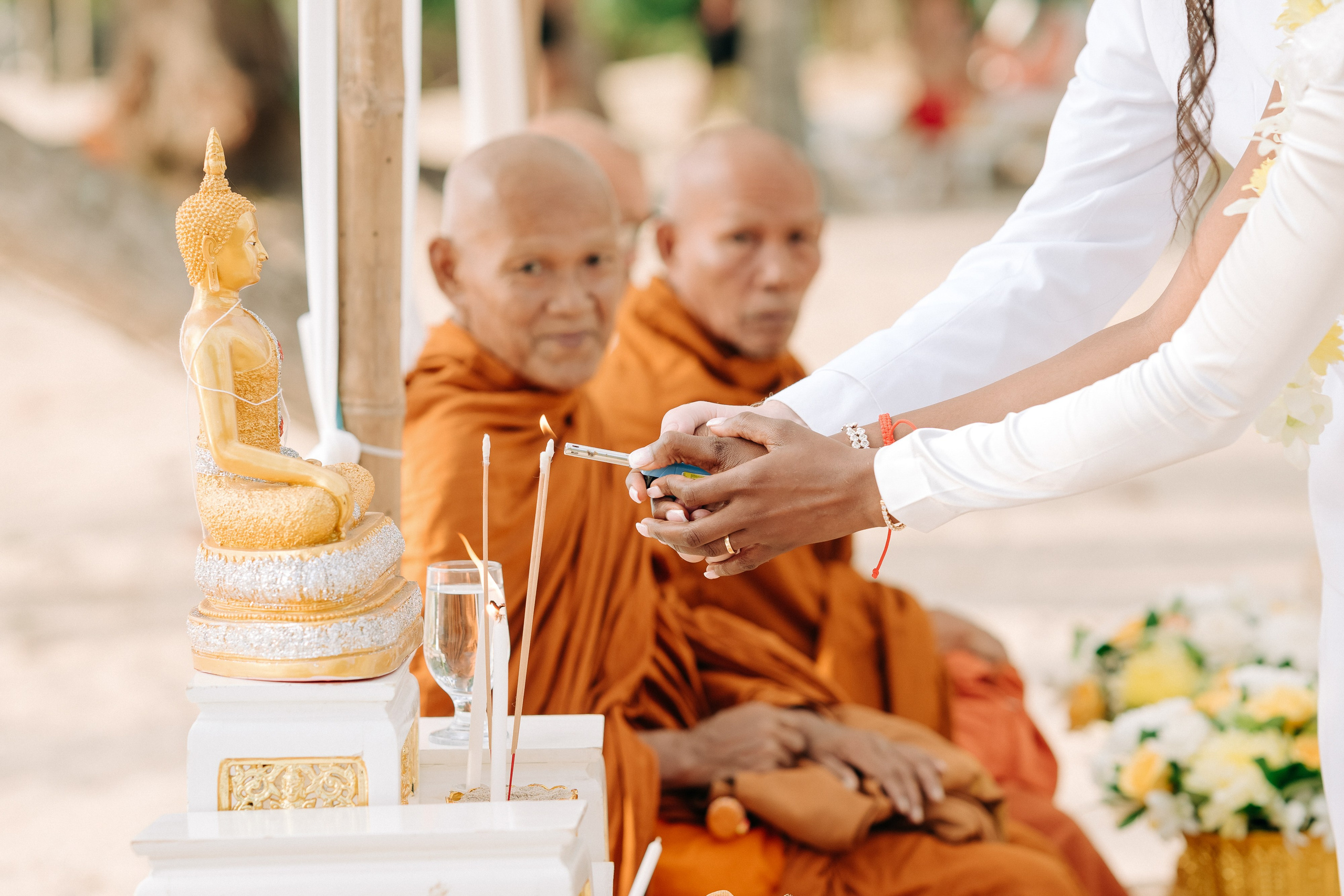 Couple celebrating a spiritual Buddhist wedding ceremony on Koh Samui