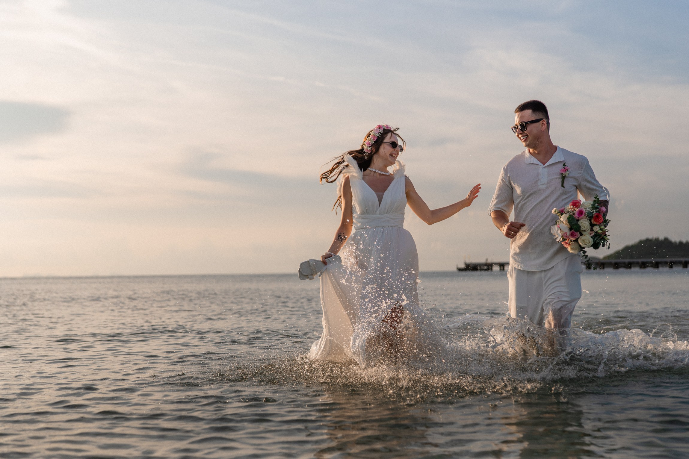 Bride and groom during a romantic beach wedding ceremony on Koh Samui, Thailand, surrounded by tropical scenery and ocean views
