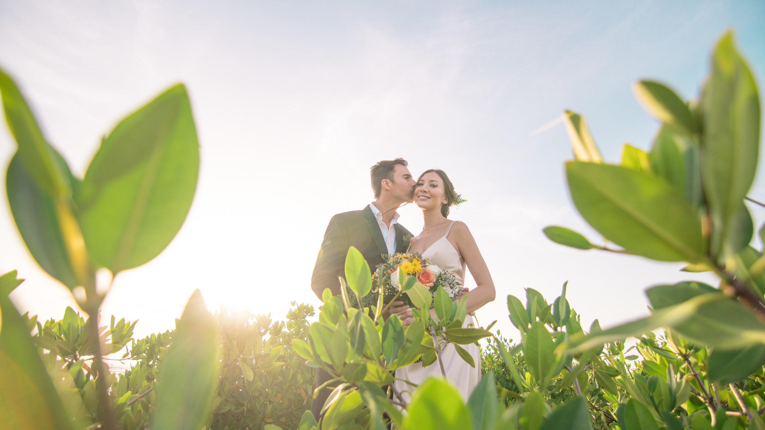 Just married couple in soft light – eco chic beach wedding photo session