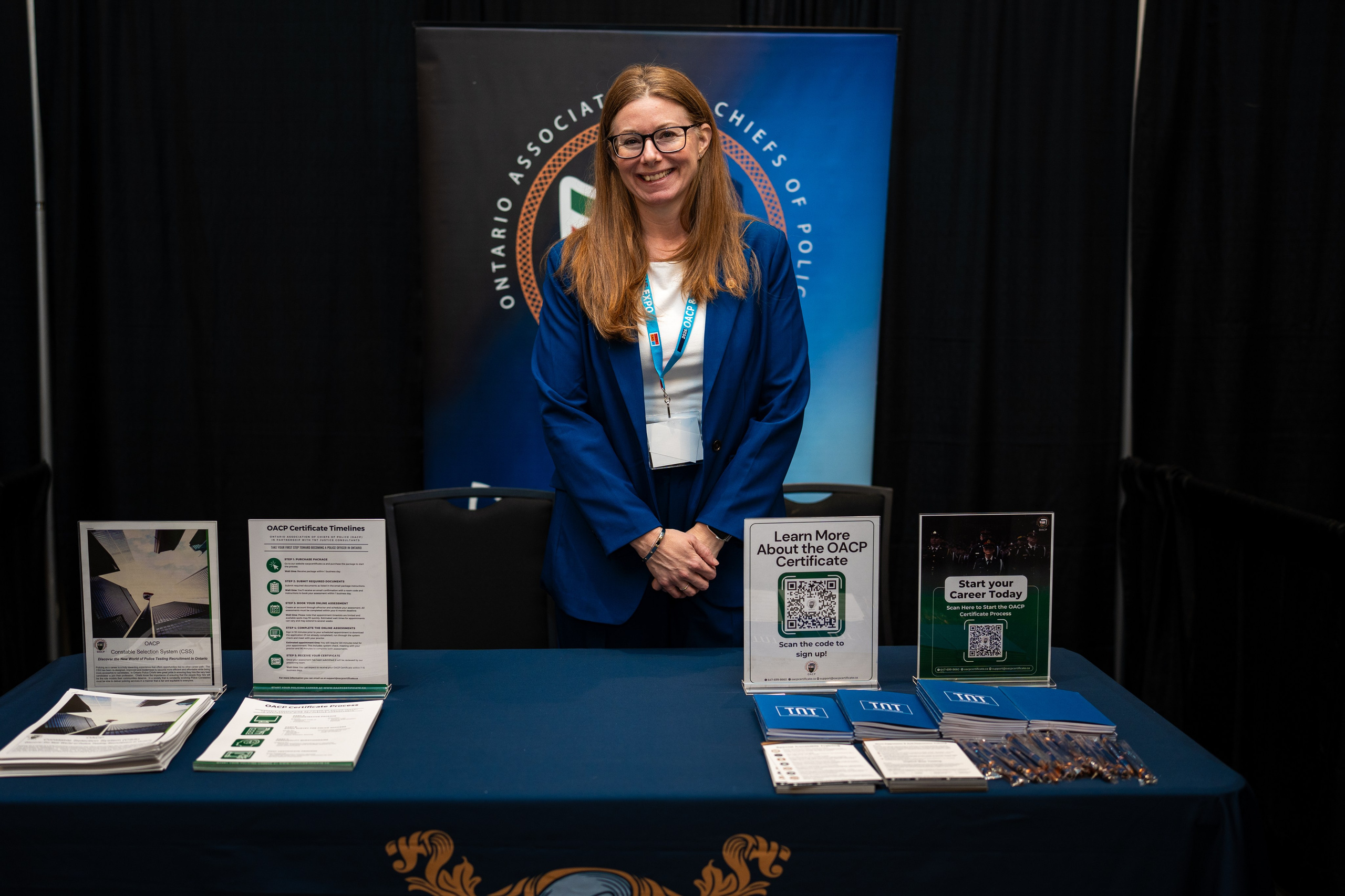 Exhibitor staff member at booth, Blueline Expo 2026 Toronto
