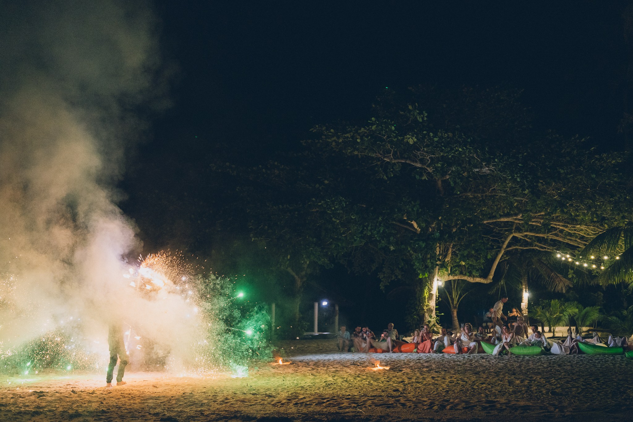 Spectacular fire show performance during a beach wedding reception in Koh Samui