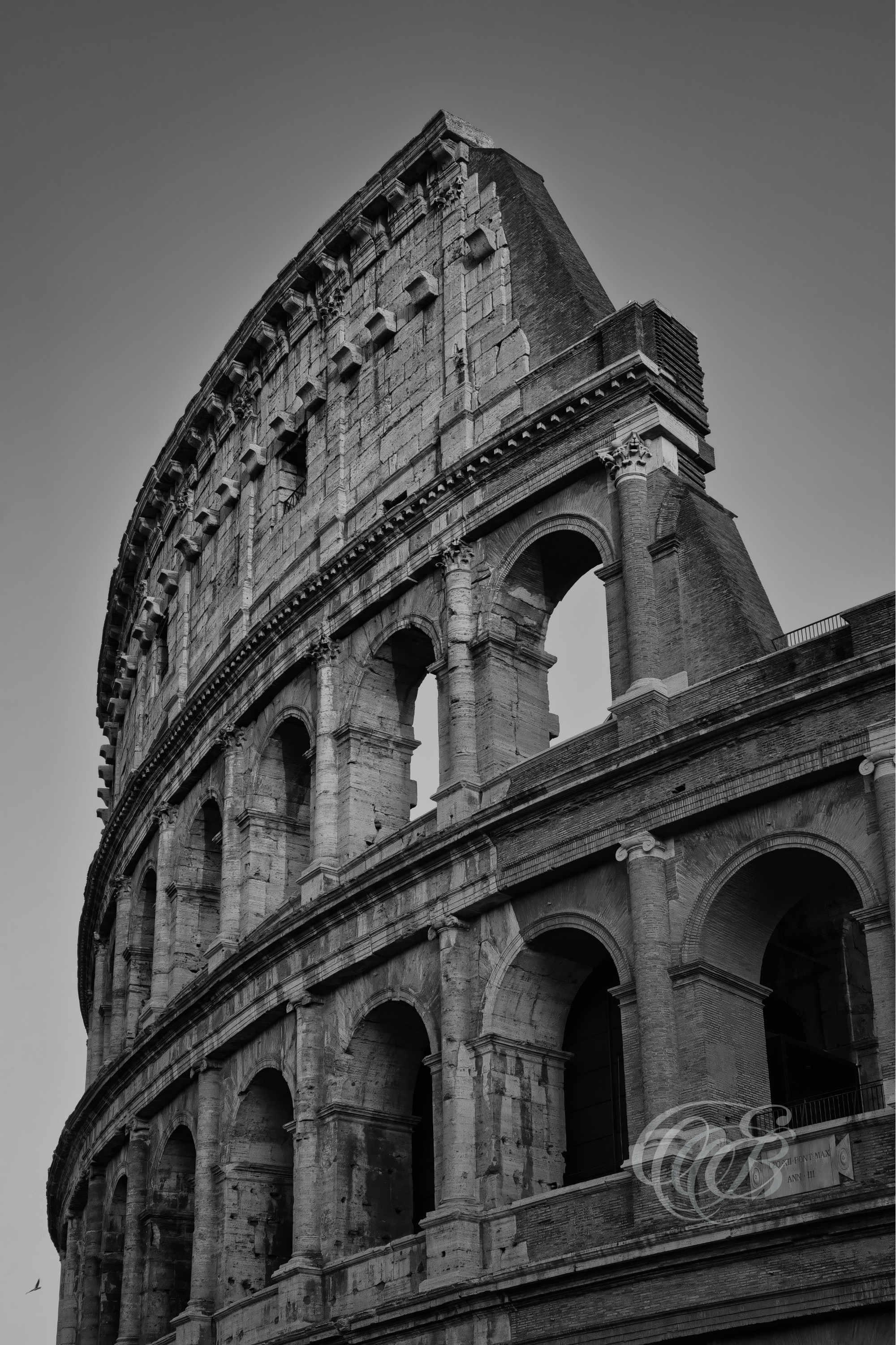 Rome Italy - The Colosseum in the late afternoon - B&W - Eduardo Bartoli Fine Art Photography - Digital fine art black and white photograph of the Colosseum (Flavian Amphitheatre) in Rome, Italy, built in the 1st century AD under Vespasian and Titus, seen in late afternoon light – photography by Eduardo Bartoli.