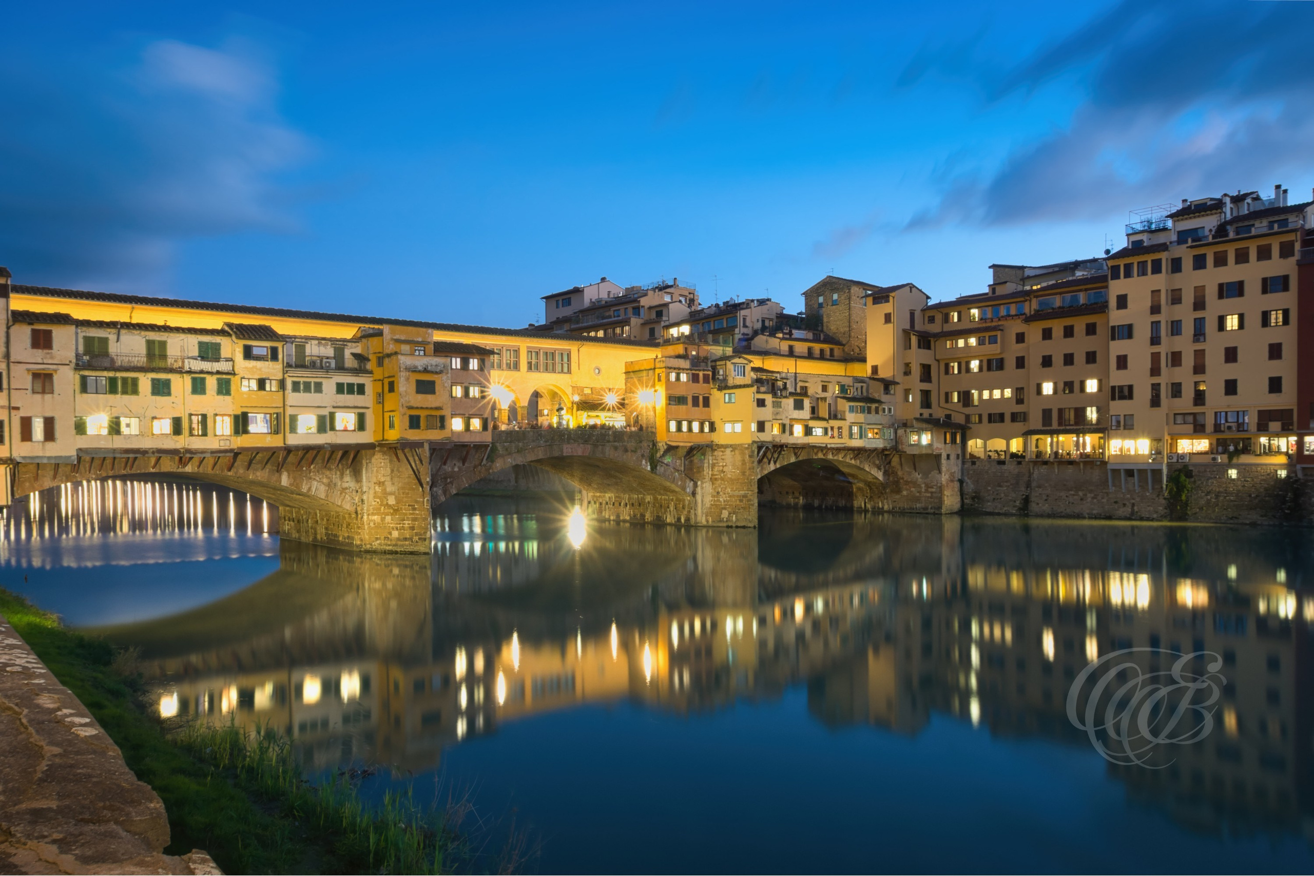 ITALY PHOTOGRAPHY — Sunset with a View of the Ponte Vecchio — Ponte Vecchio spanning the Arno River, one of Florence's most historic bridges and enduring architectural landmarks, Florence, Italy — Eduardo Bartoli Photography.