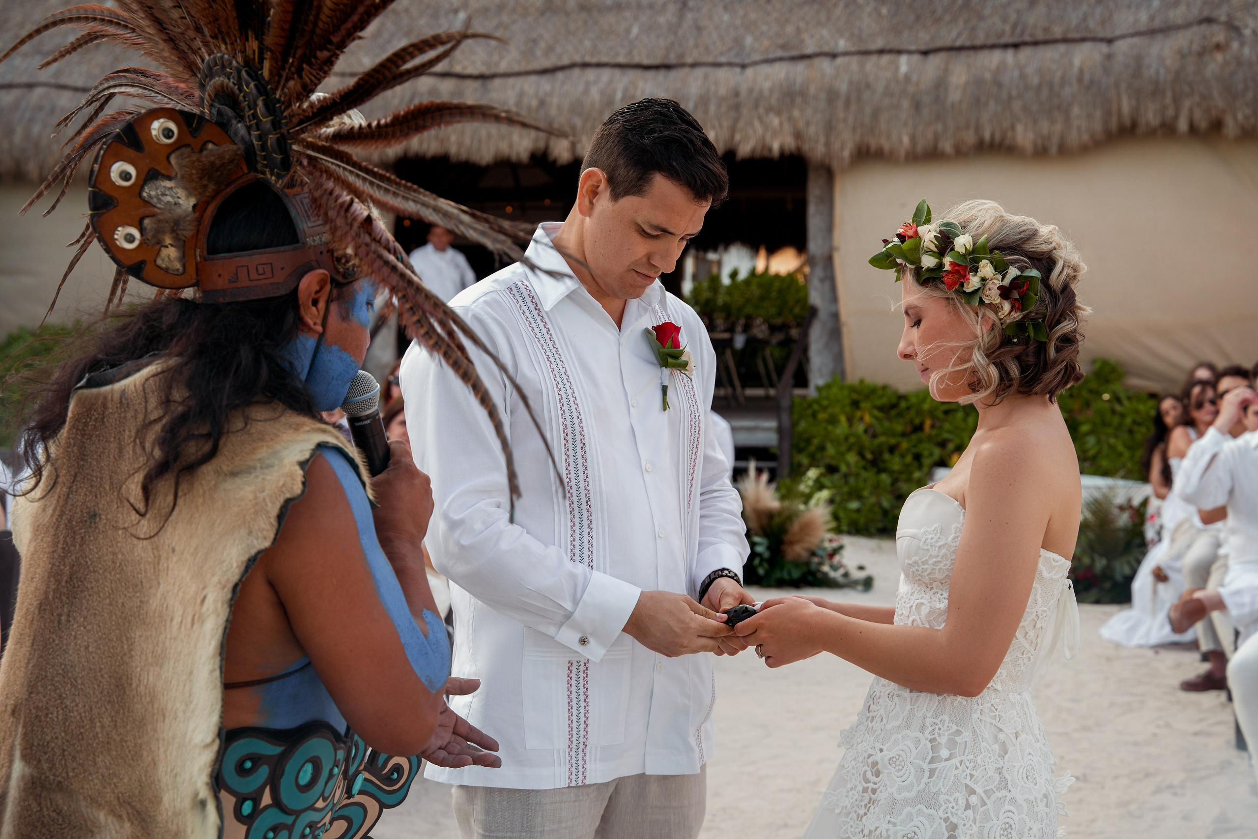 Bride and groom during Mayan ritual in Cancun