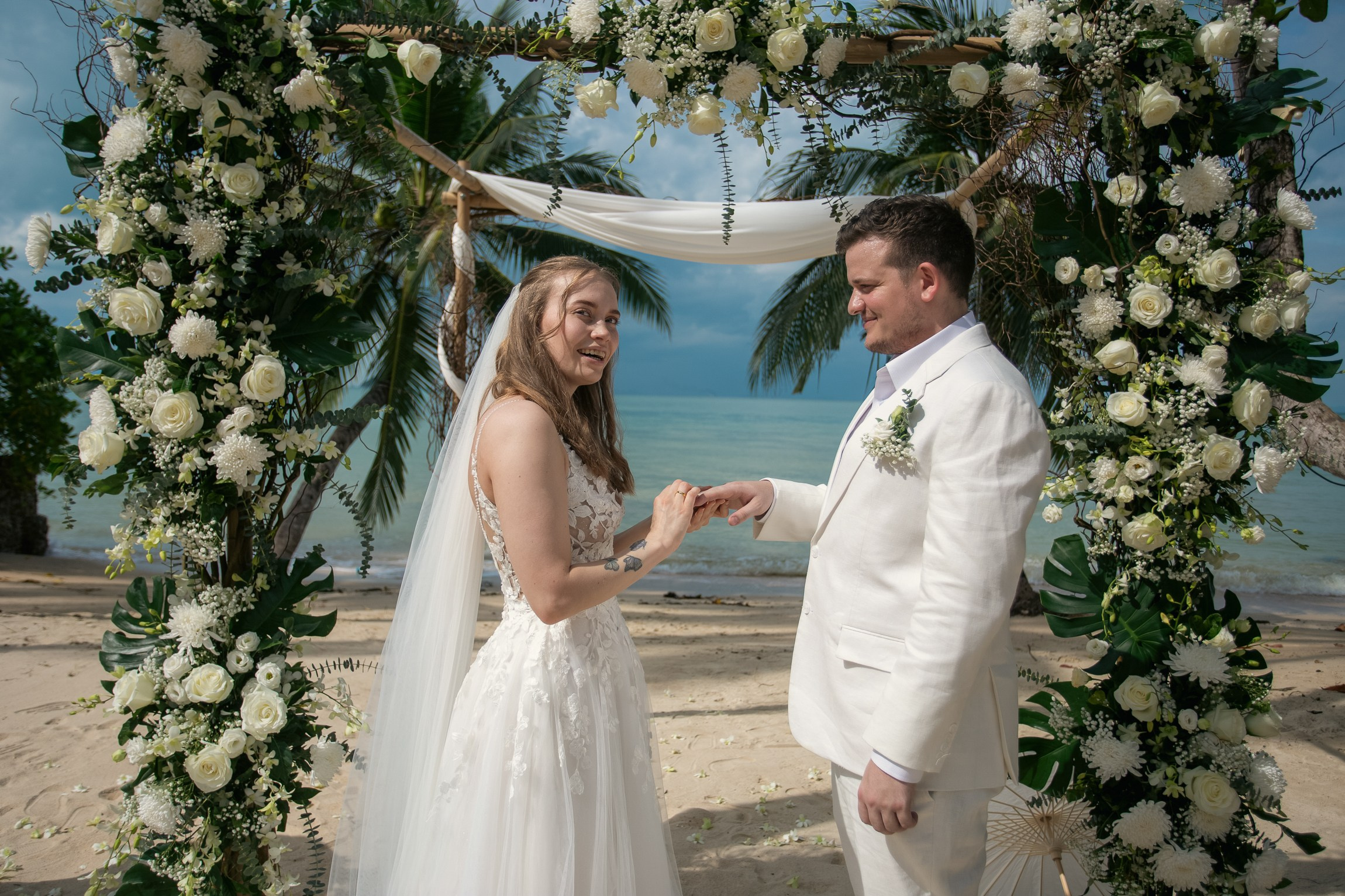 Elegant escape wedding for two on a beautiful beach in Koh Samui, Thailand with romantic wedding decorations