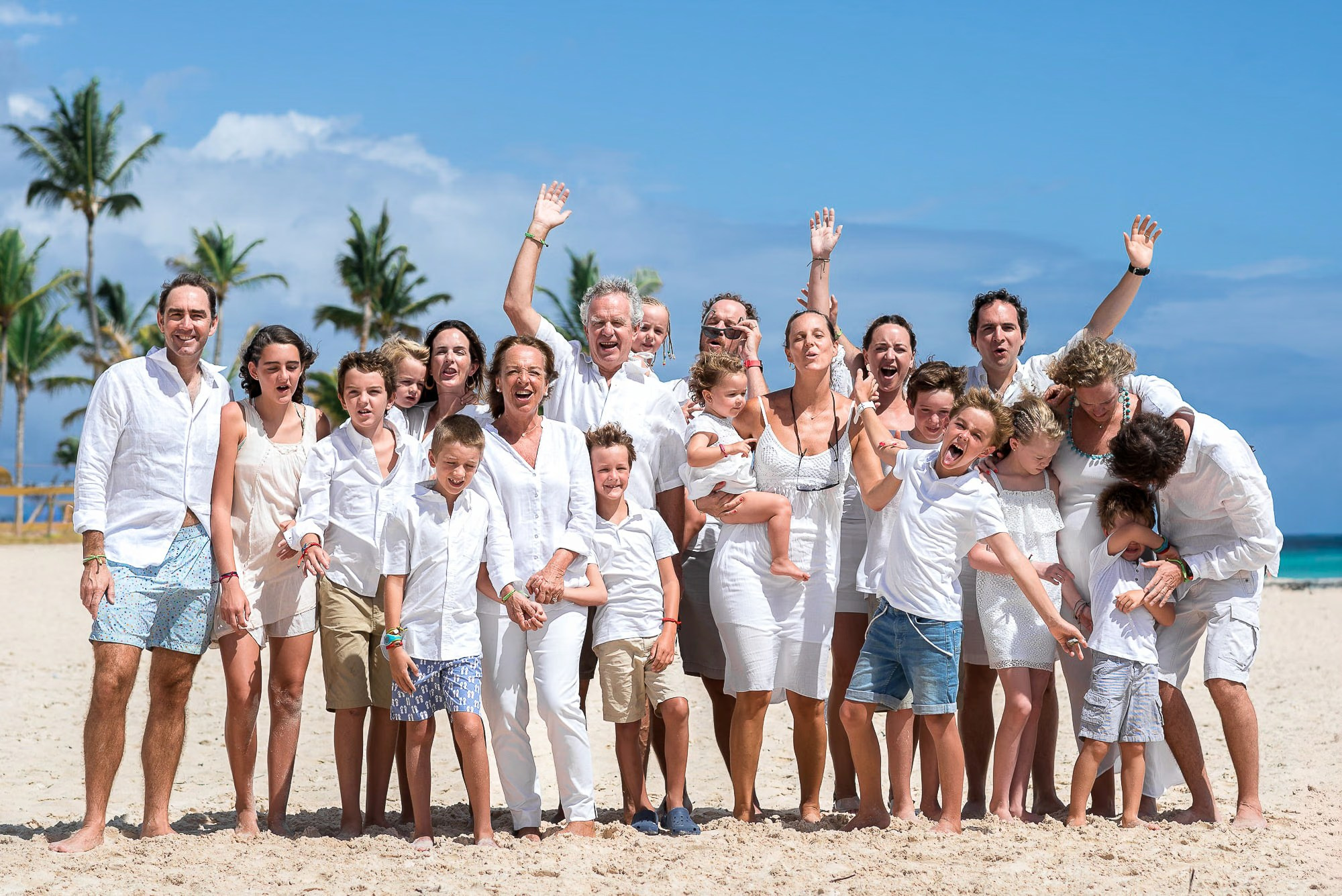 Punta Cana family photoshoot featuring parents and children enjoying a beach vacation.