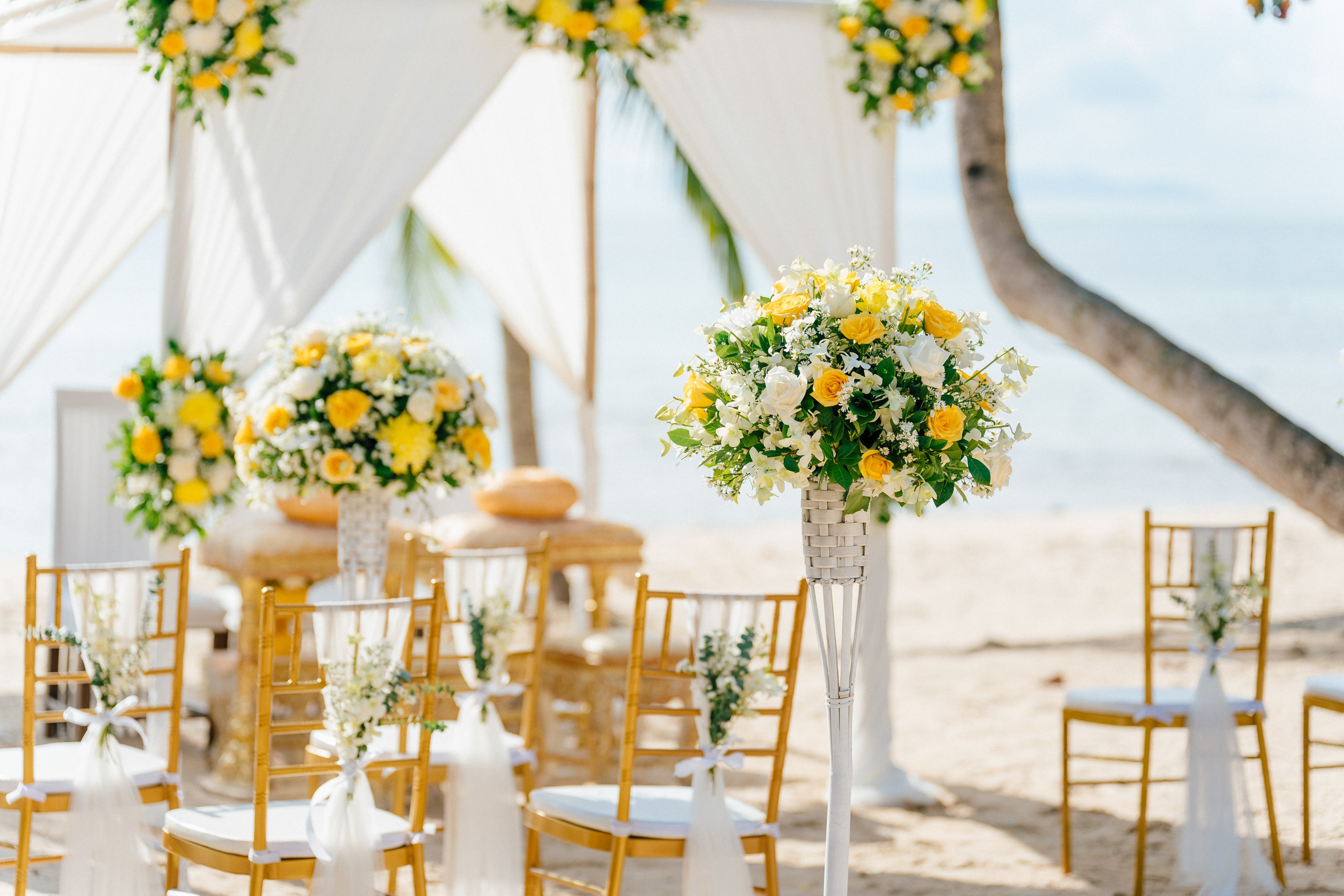 Couple celebrating a spiritual Buddhist wedding ceremony on Koh Samui