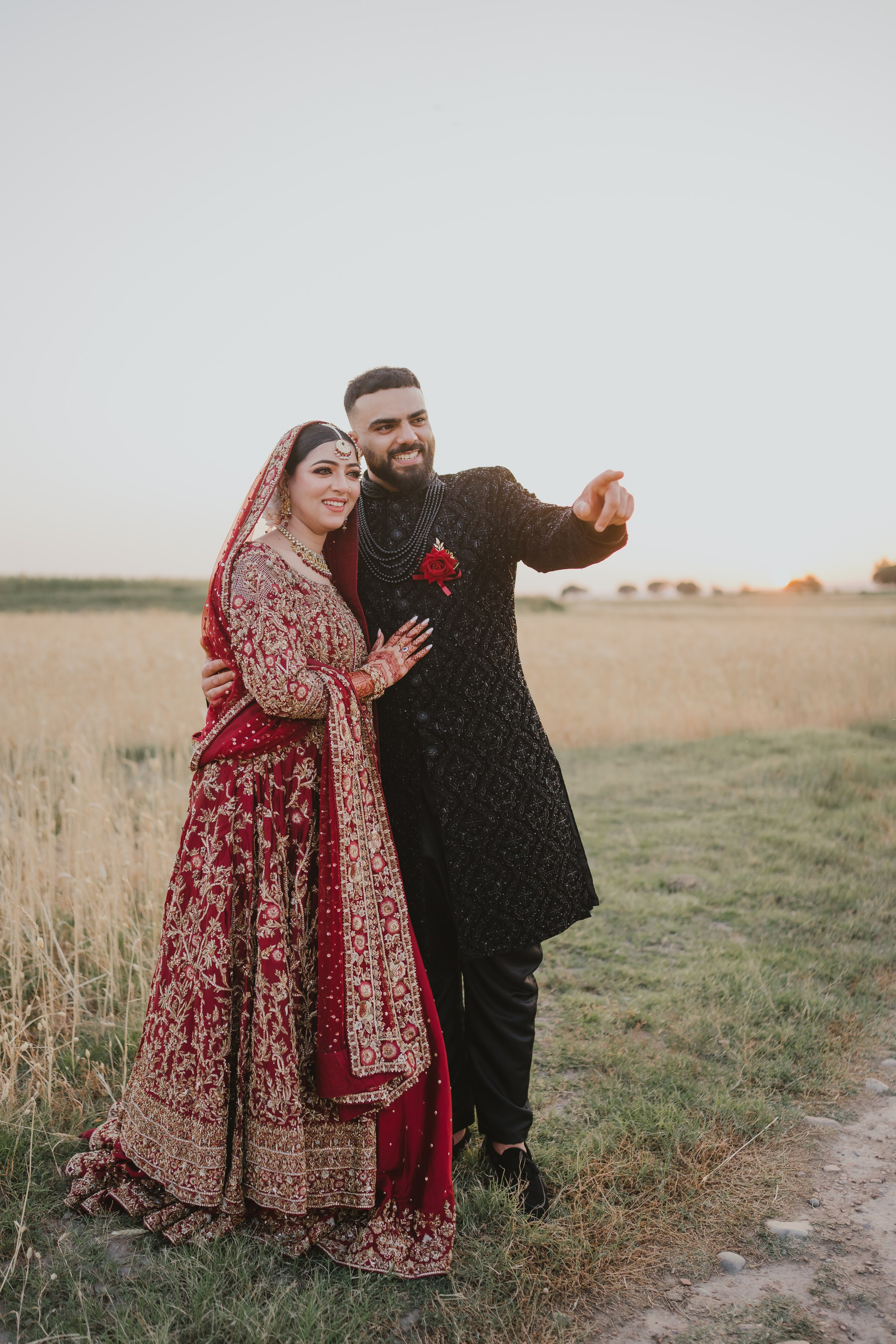 Couple shoot in the fields during sunset 