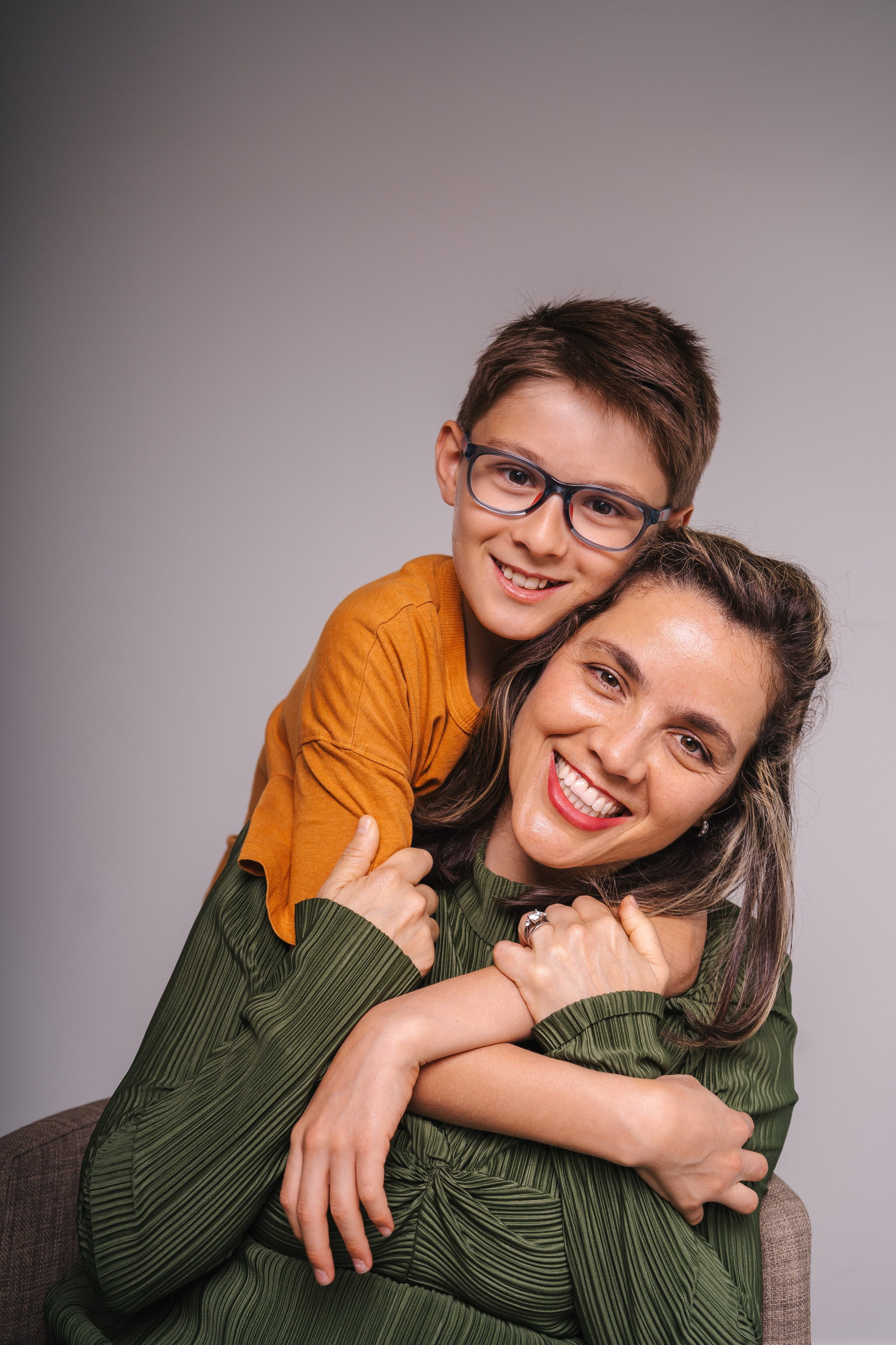 Mother and son hugging in photography studio in Burnaby
