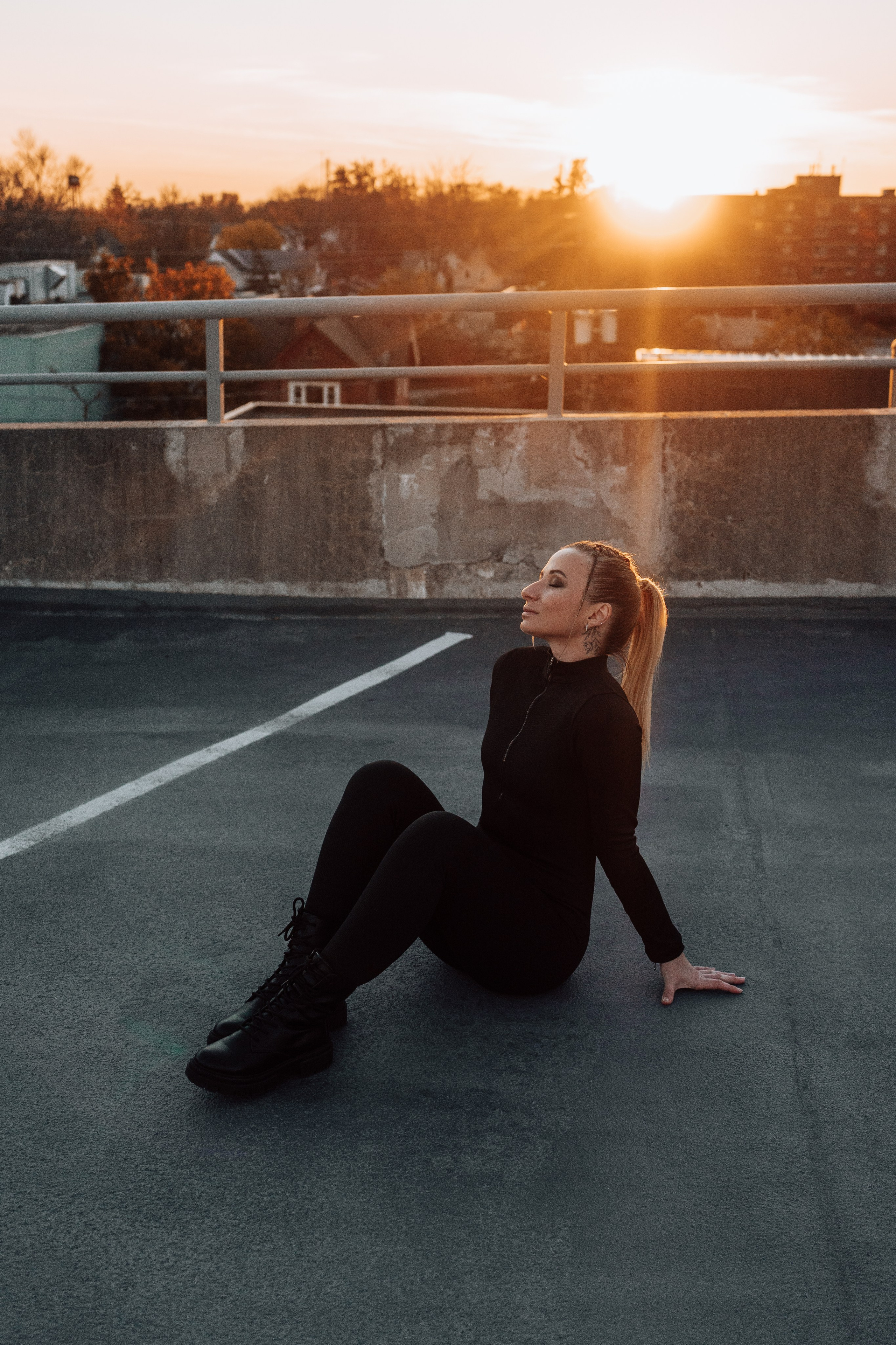 Creative individual portrait photoshoot on a rooftop in Windsor, Ontario, capturing unique style and personality.