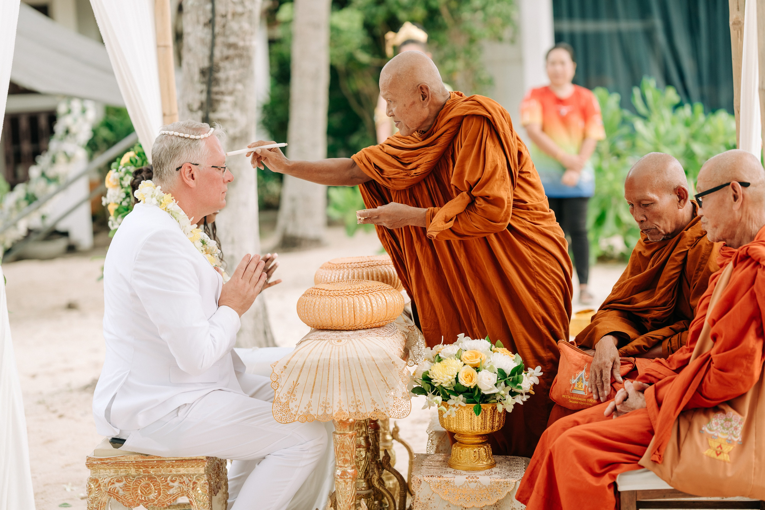 Romantic Buddhist wedding ceremony with guests in Koh Samui, Thailand