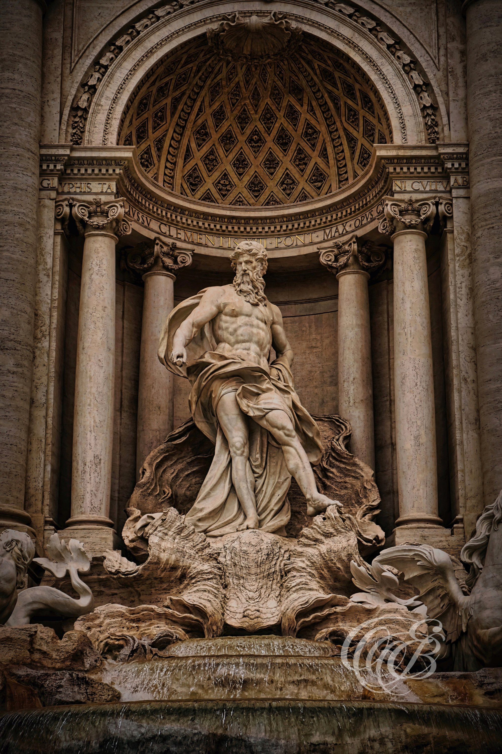 ITALY TRAVEL PHOTOGRAPHY – ITALY – ROME — Trevi Fountain Oceanus — Central sculpture of Oceanus in the Trevi Fountain Baroque composition integrated into Palazzo Poli, Rome, Italy — Eduardo Bartoli Photography.