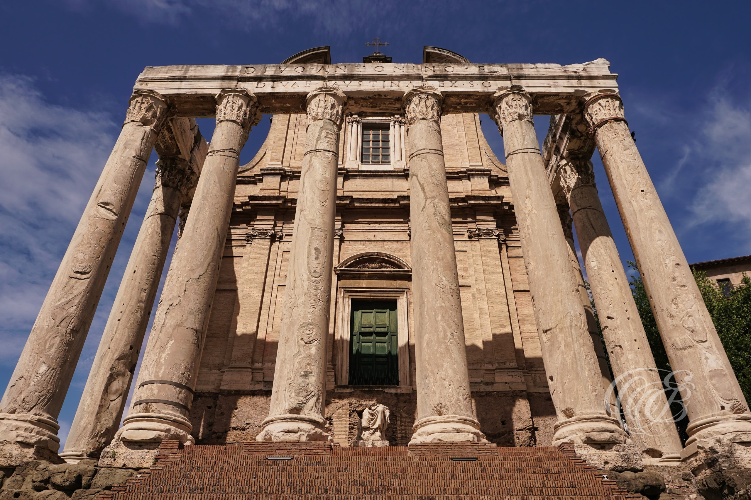 ITALY TRAVEL PHOTOGRAPHY – ITALY – ROME — Antoninus and Faustina Temple in Bright Spring Light — Ancient Roman temple in the Forum built in 141 AD with Corinthian columns and preserved façade, later converted into a church, Rome, Italy — Eduardo Bartoli Photography.