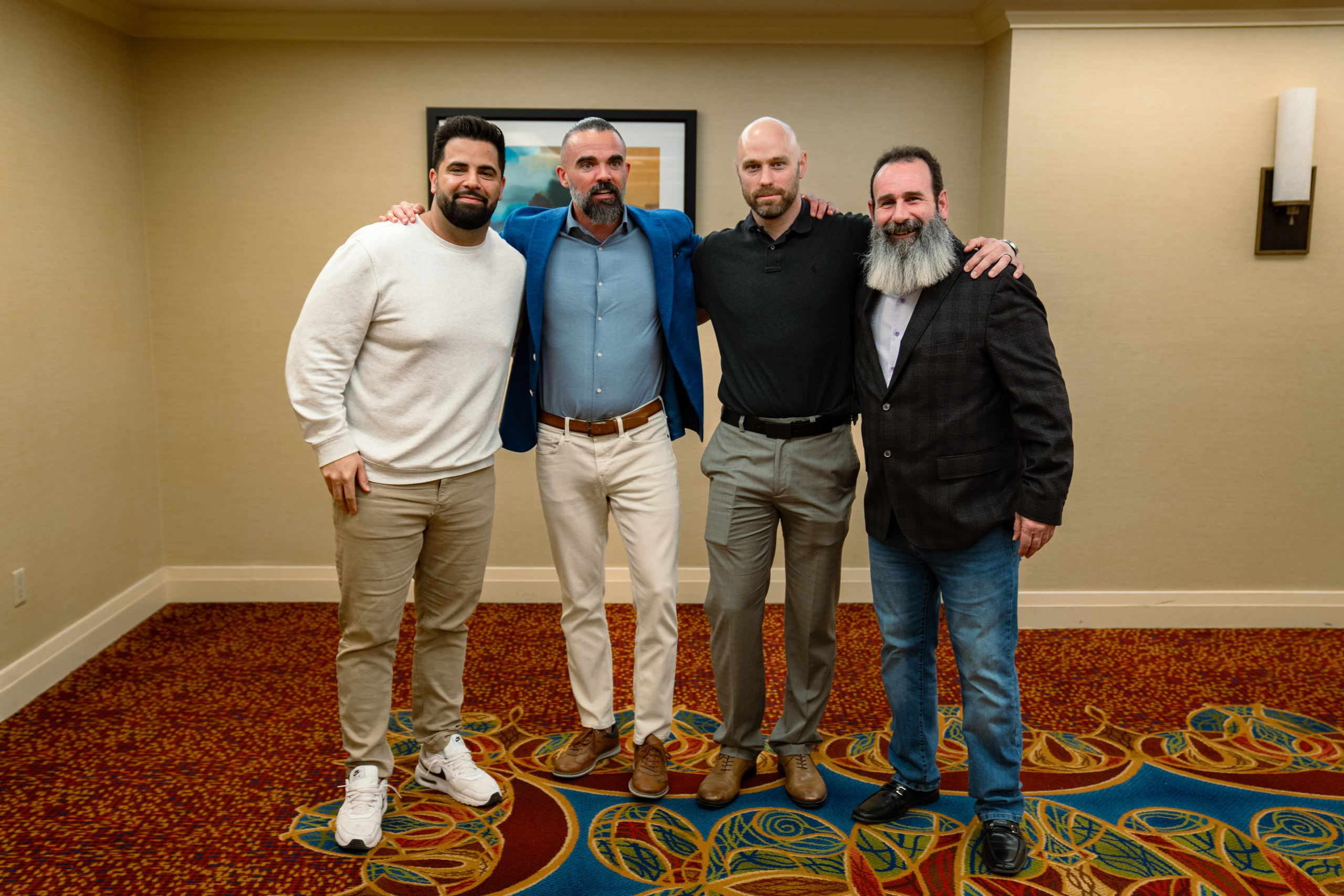 Group photo of attendees posing at real estate networking event
