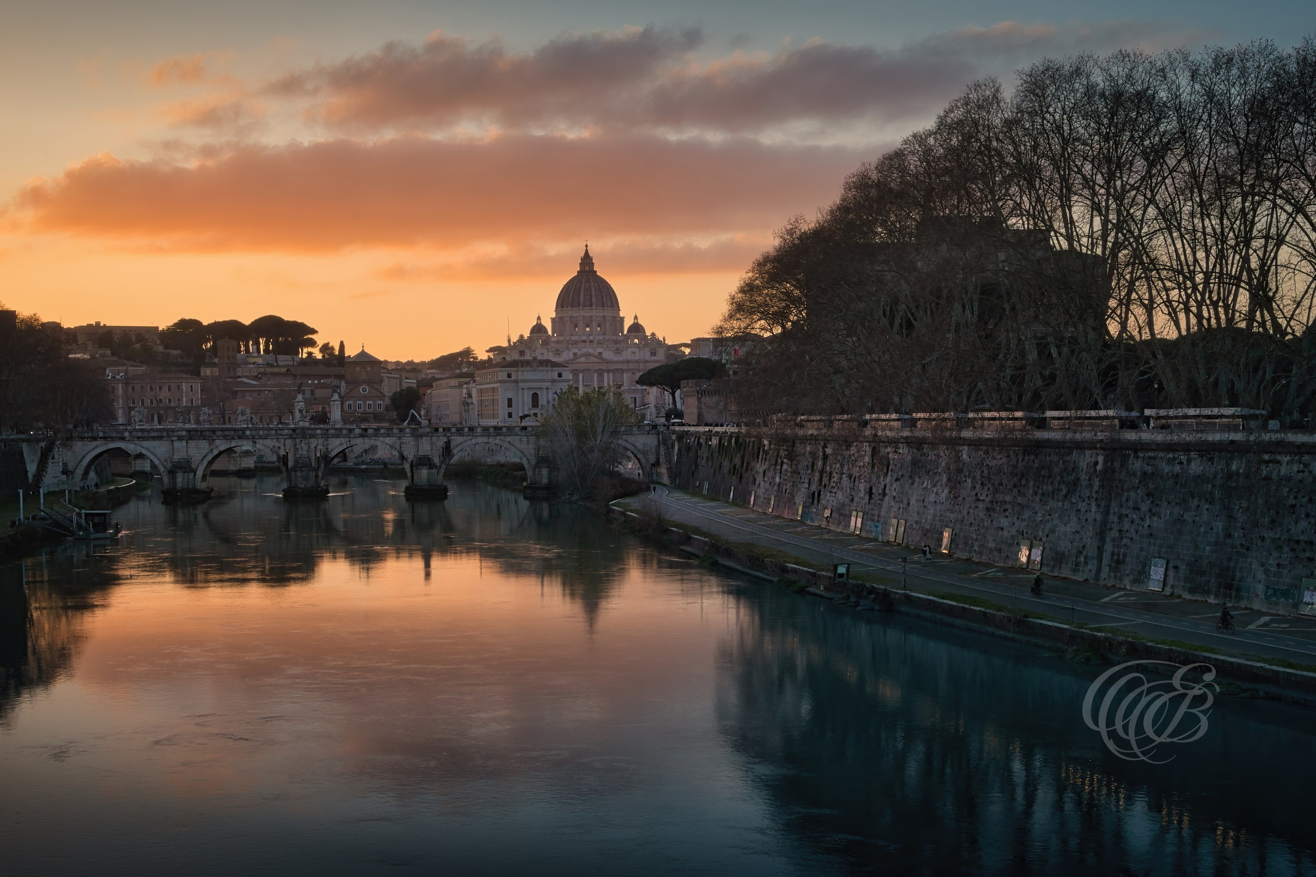 Rome Italy — Ponte Sant’Angelo with Vatican dome view — Eduardo Bartoli Fine Art Photography — Photograph of Ponte Sant’Angelo spanning the Tiber River with the dome of St. Peter’s Basilica in the Vatican in Rome, Italy — photography by Eduardo Bartoli.
