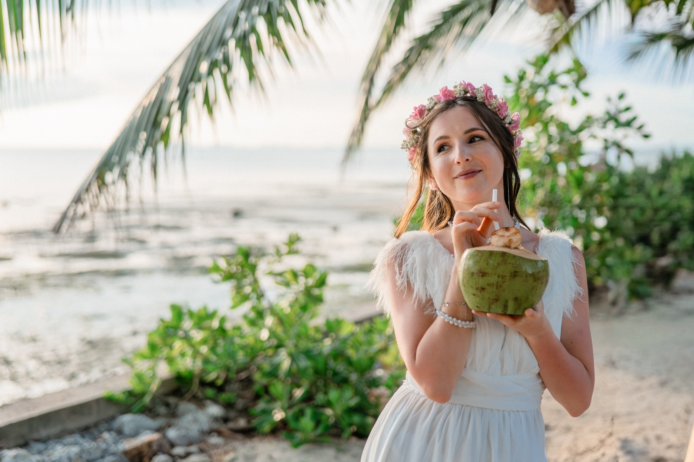 Bride and groom exchanging vows on a private sunset beach