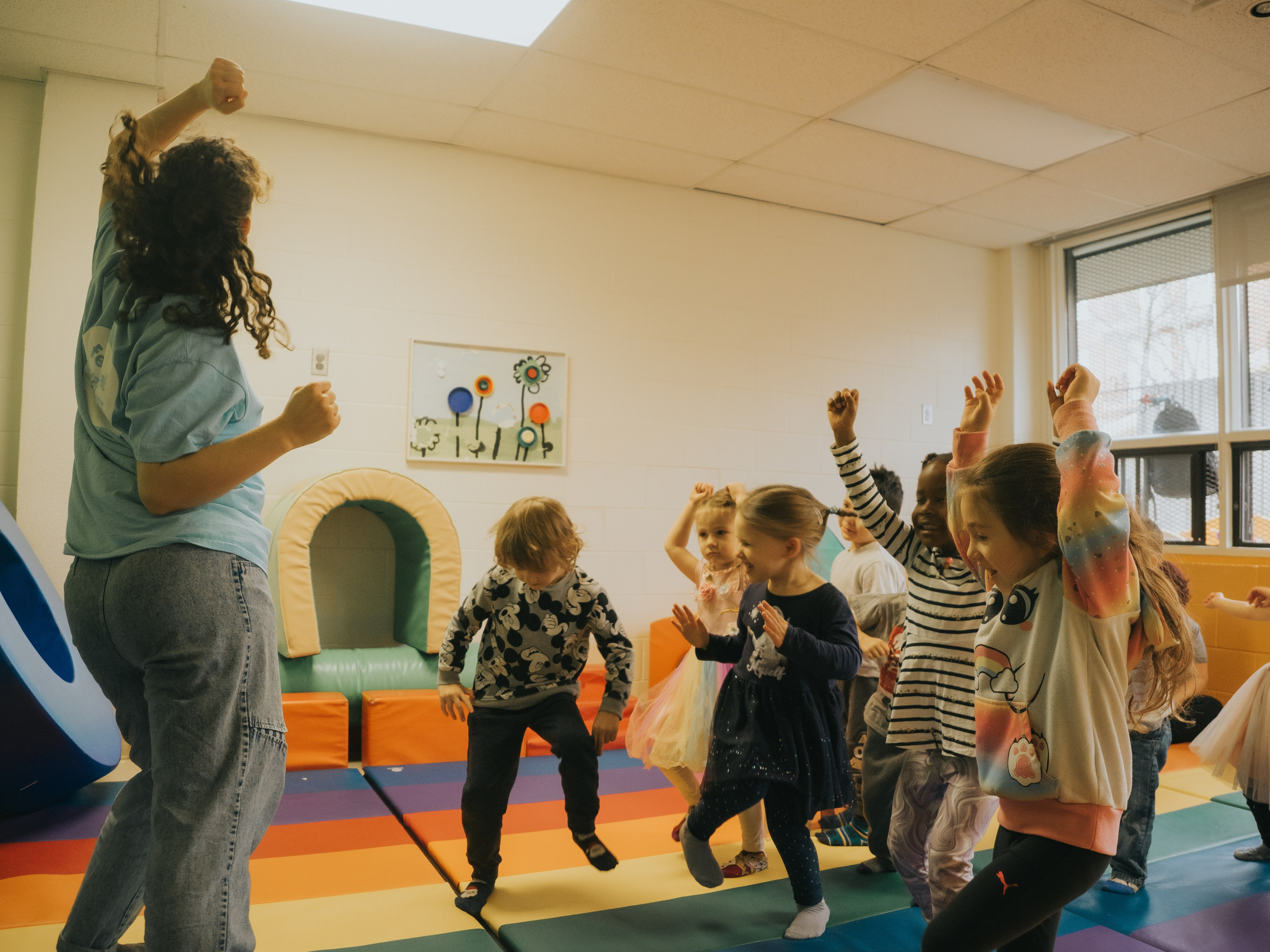 Children throwing their hands in the air.