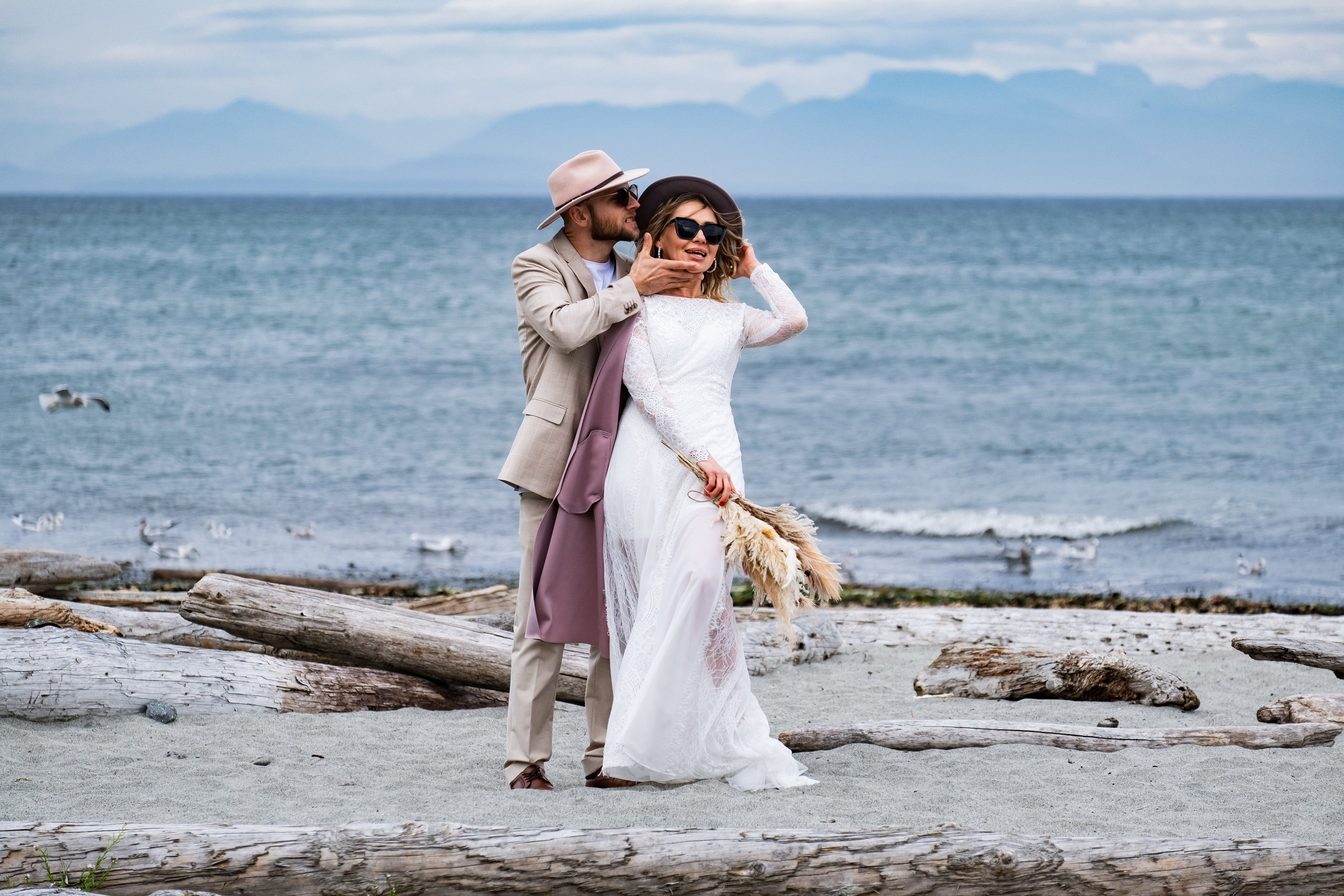 emotional couple moment standing by the shoreline, BC
