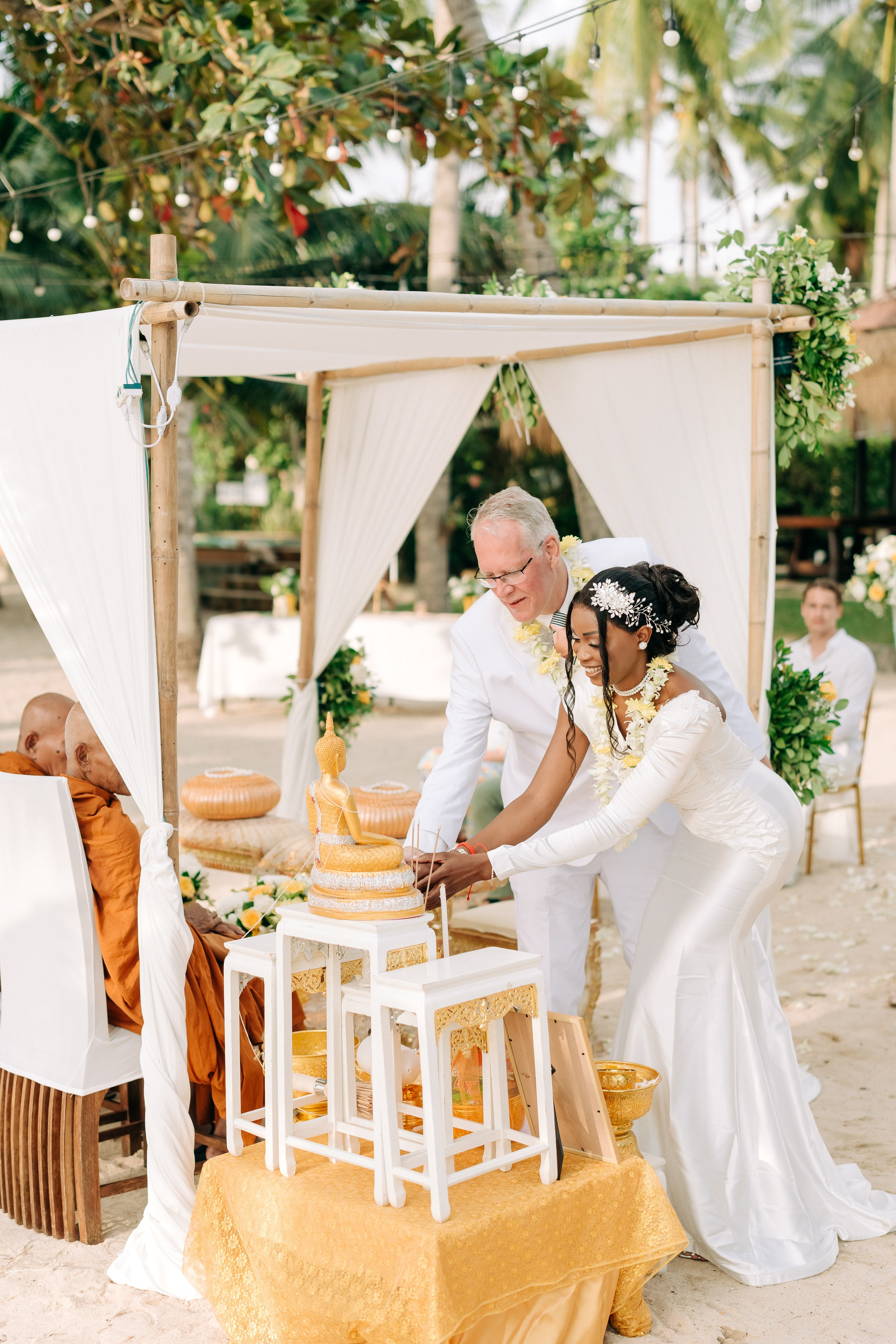 Romantic Buddhist wedding ceremony with guests in Koh Samui, Thailand