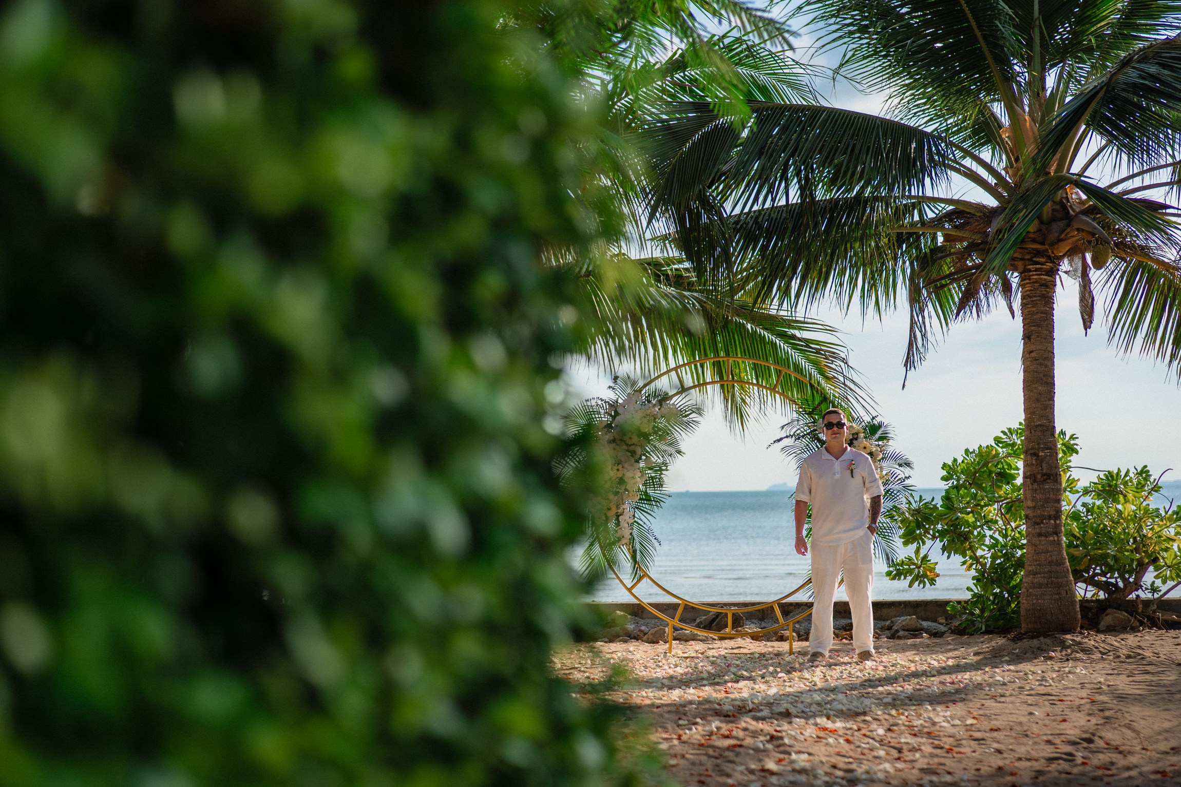 Bride and groom exchanging vows on a private sunset beach