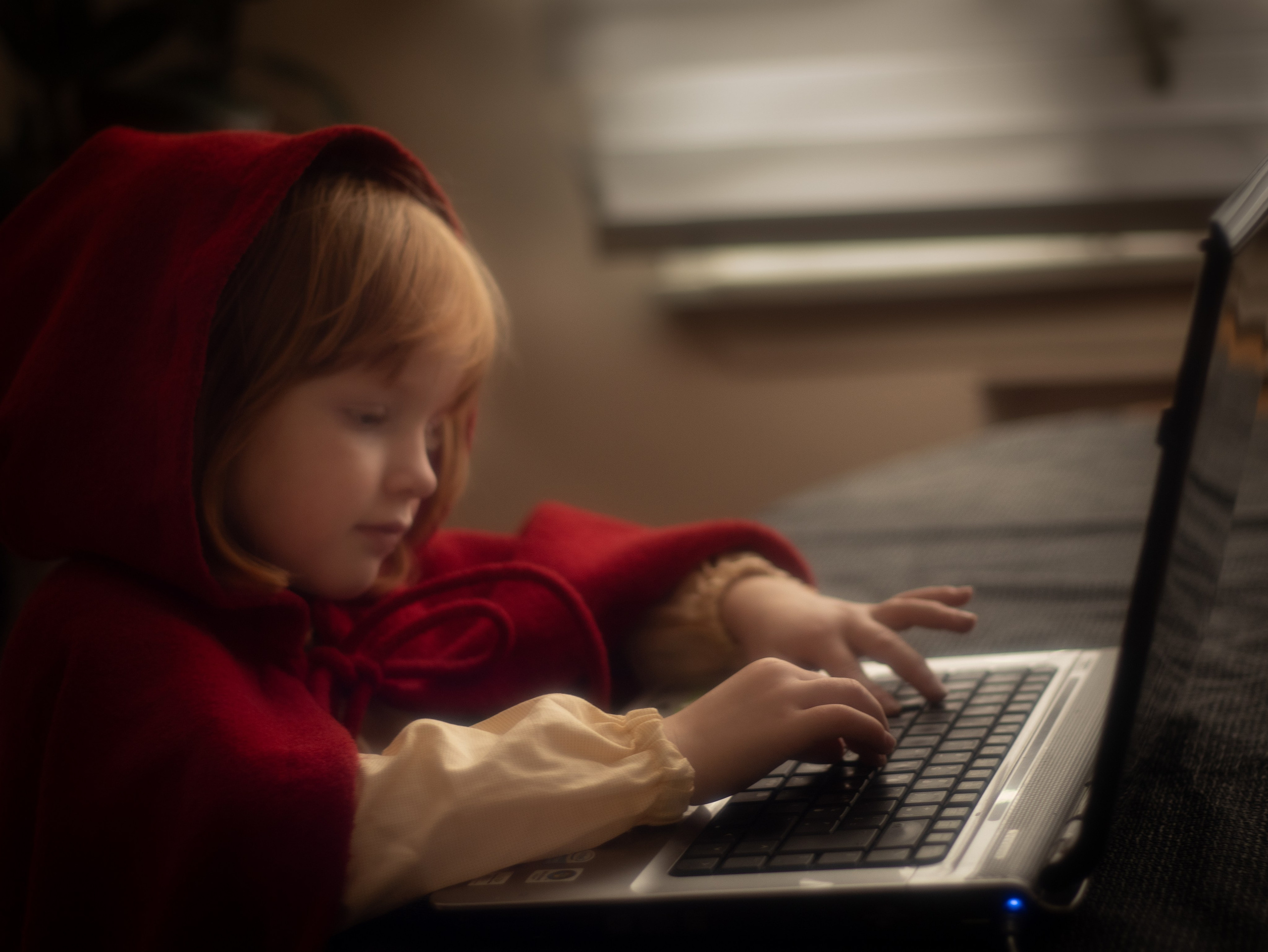 A child behind a computer