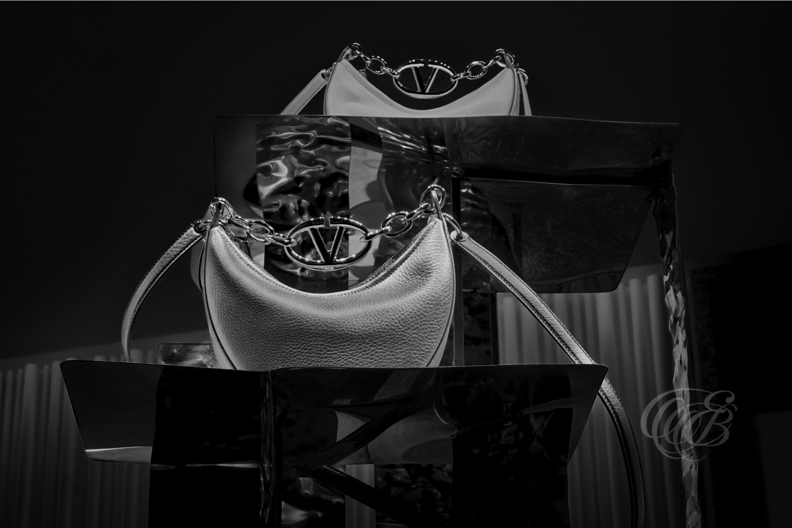 Rome, Italy – Valentino boutique bag detail in black and white showing leather texture and metallic hardware reflections, luxury fashion material study – fashion photography, Valentino Rome – Eduardo Bartoli Photography.
