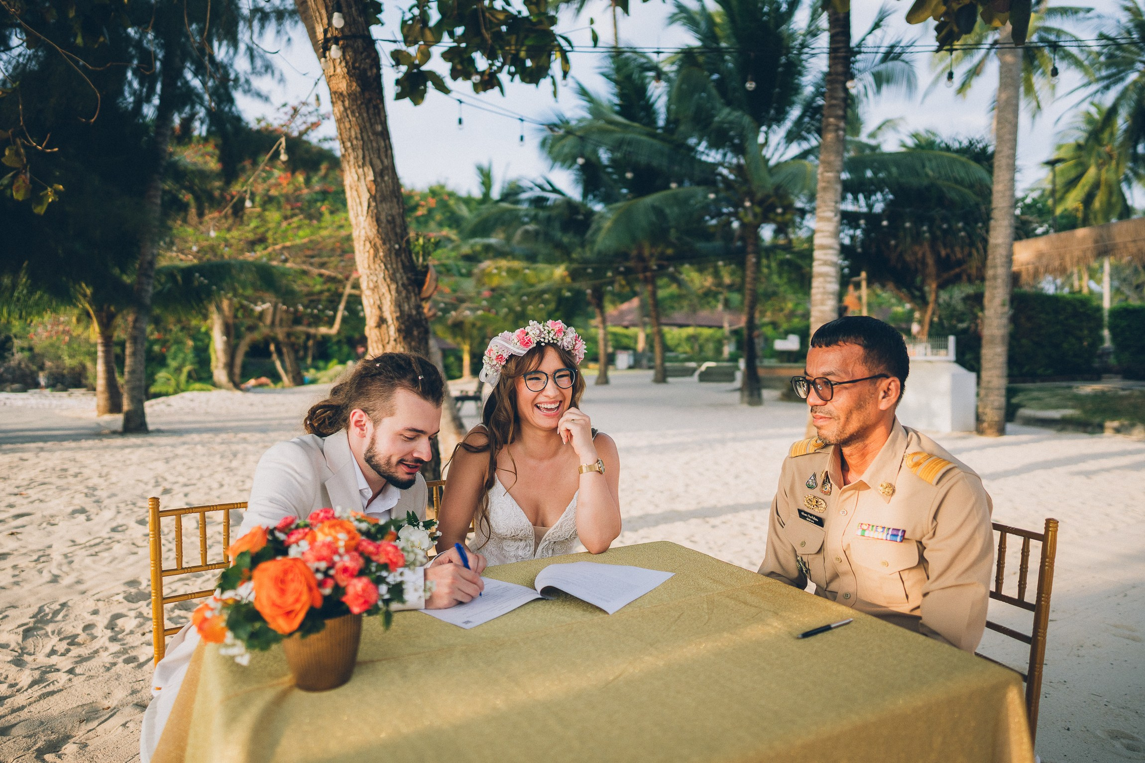 Bride and groom enjoying a just for 2 beach wedding in Koh Samui, Thailand, surrounded by tropical scenery and ocean views