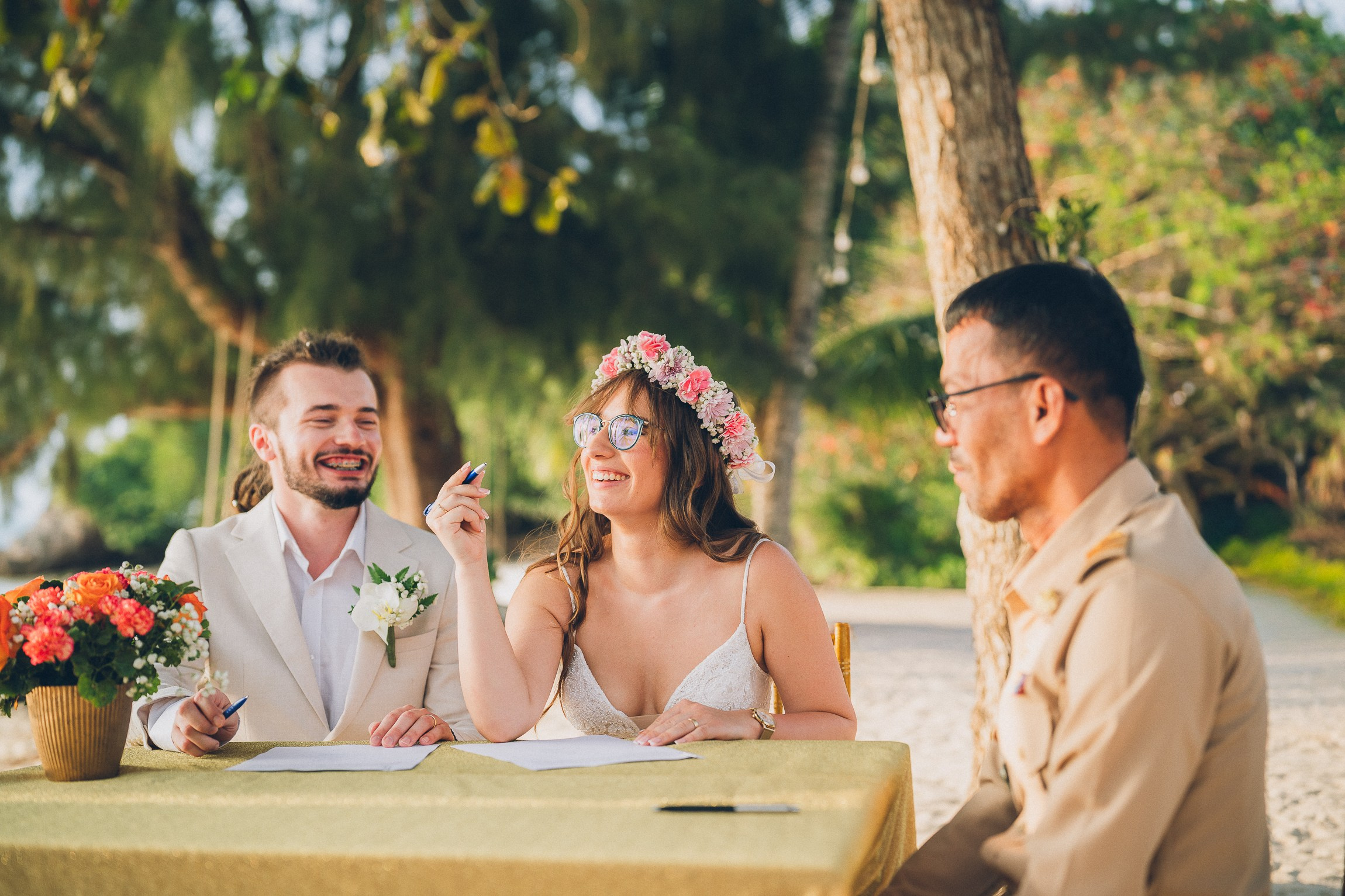 Intimate wedding for two on a tropical beach in Koh Samui, Thailand with a floral wedding setup and sea view