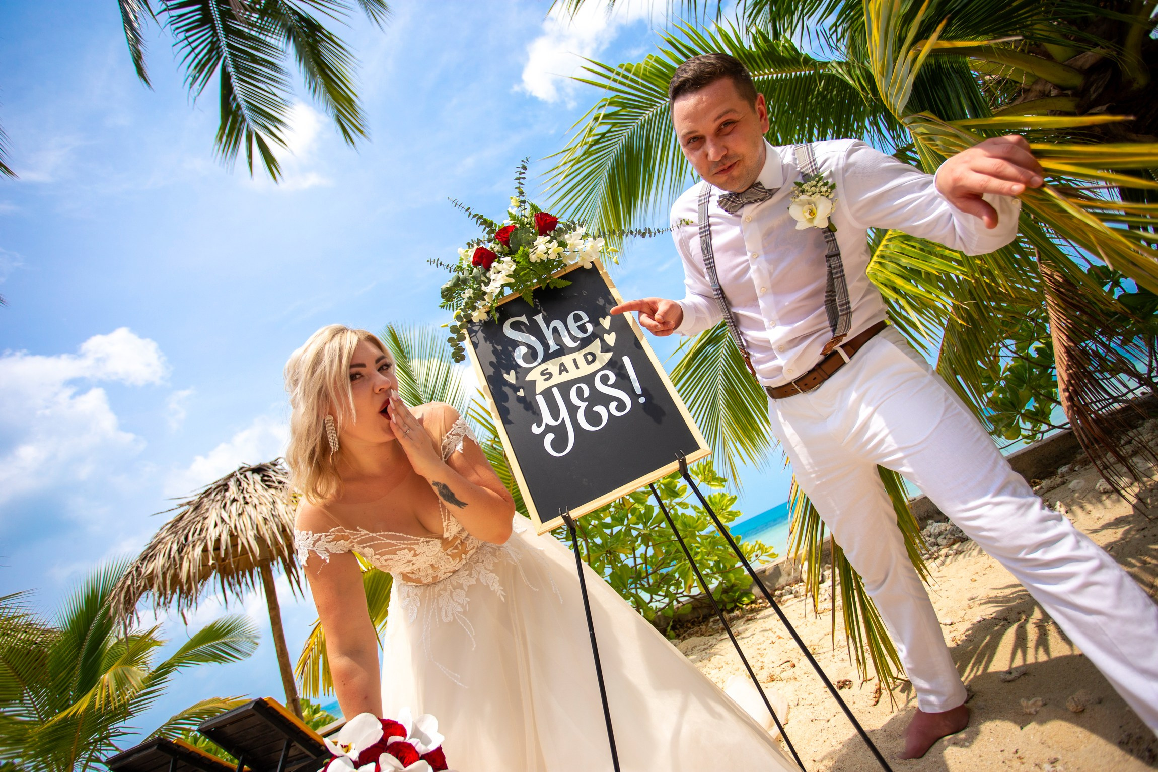 Bride and groom during a romantic beach wedding ceremony on Koh Samui, Thailand, surrounded by tropical scenery and ocean views