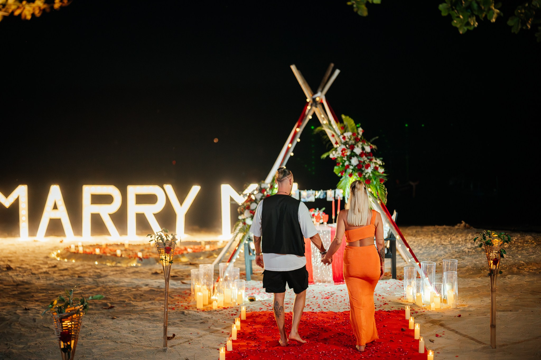Romantic dinner and proposal setup on Koh Samui beach for couples celebrating engagement.