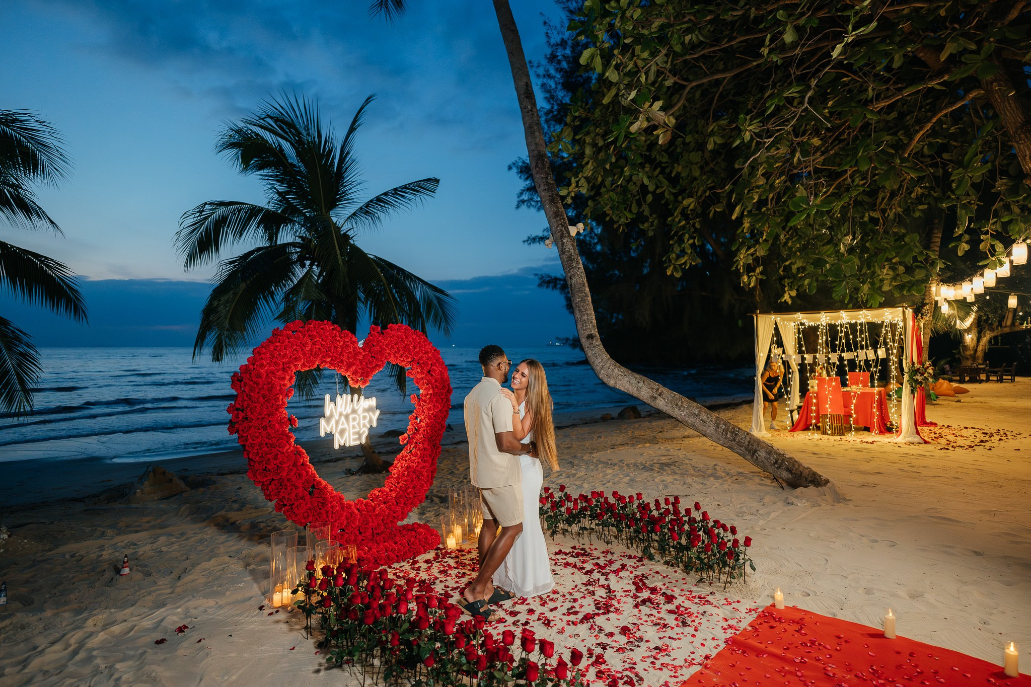Romantic dinner and proposal setup on Koh Samui beach for couples celebrating engagement.